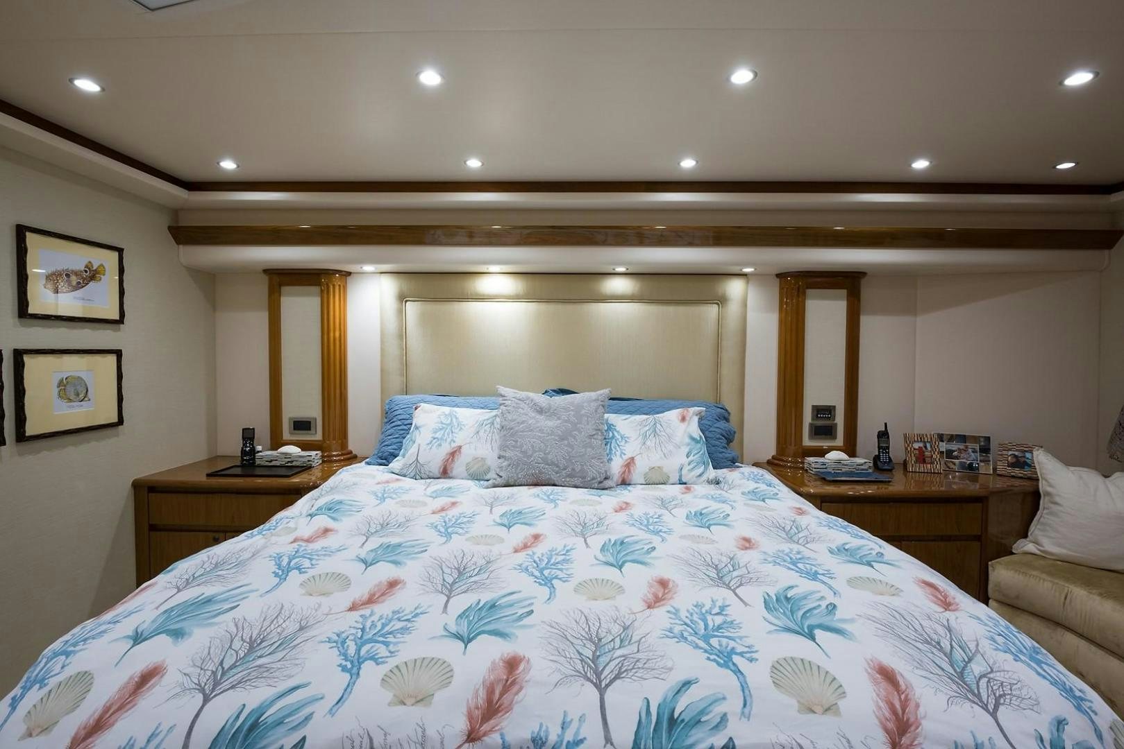 a bed with a blue comforter aboard NO NAME 82 Yacht for Sale
