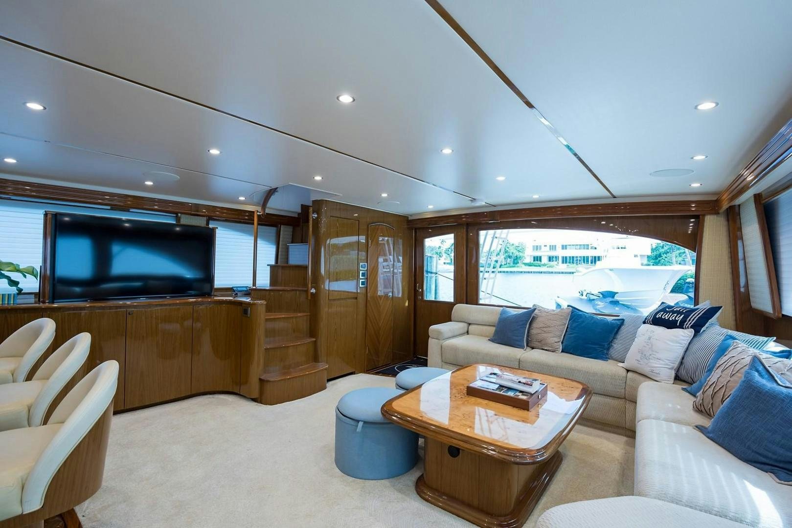 a living room with a large tv aboard NO NAME 82 Yacht for Sale