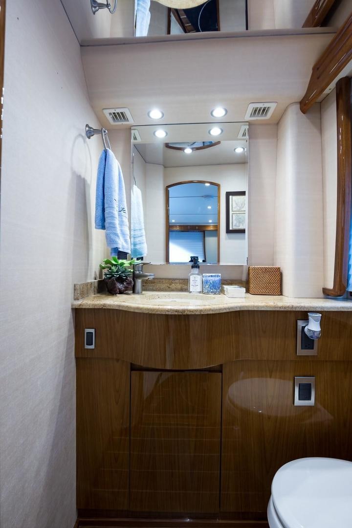 a bathroom with a sink and a mirror aboard NO NAME 82 Yacht for Sale