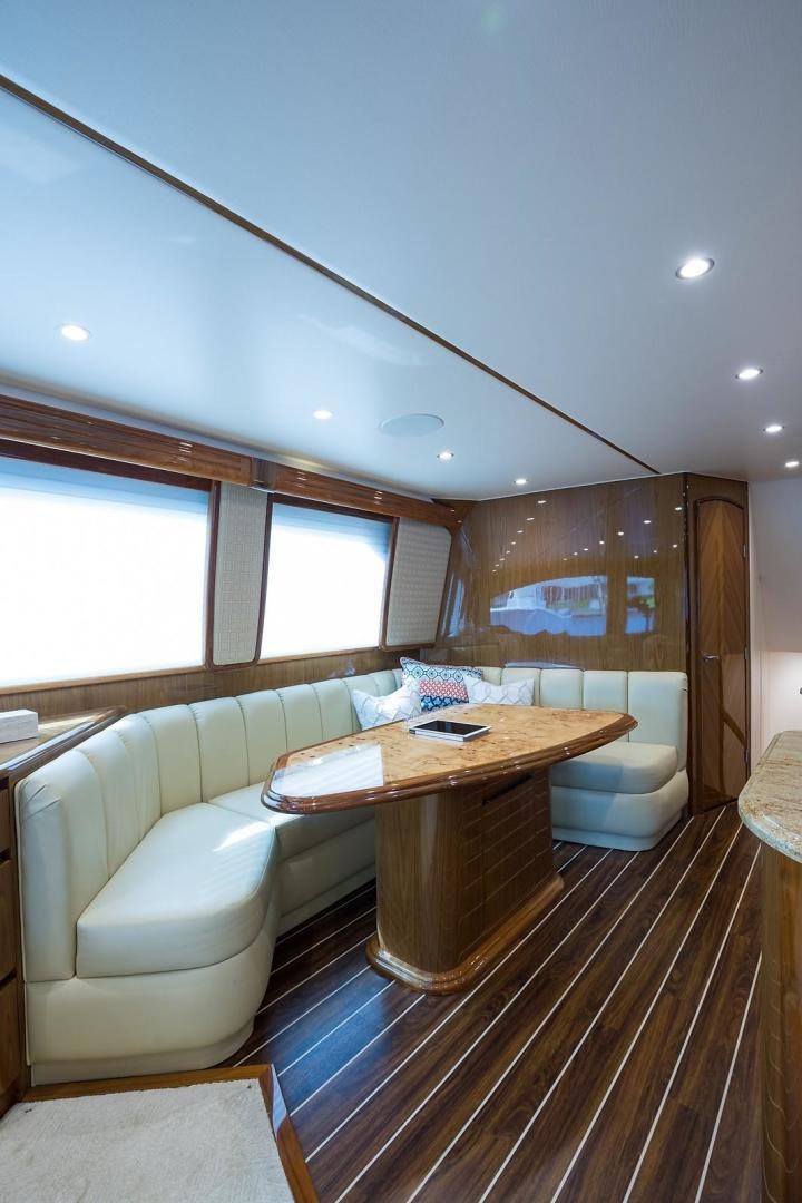 a room with a table and a couch aboard NO NAME 82 Yacht for Sale