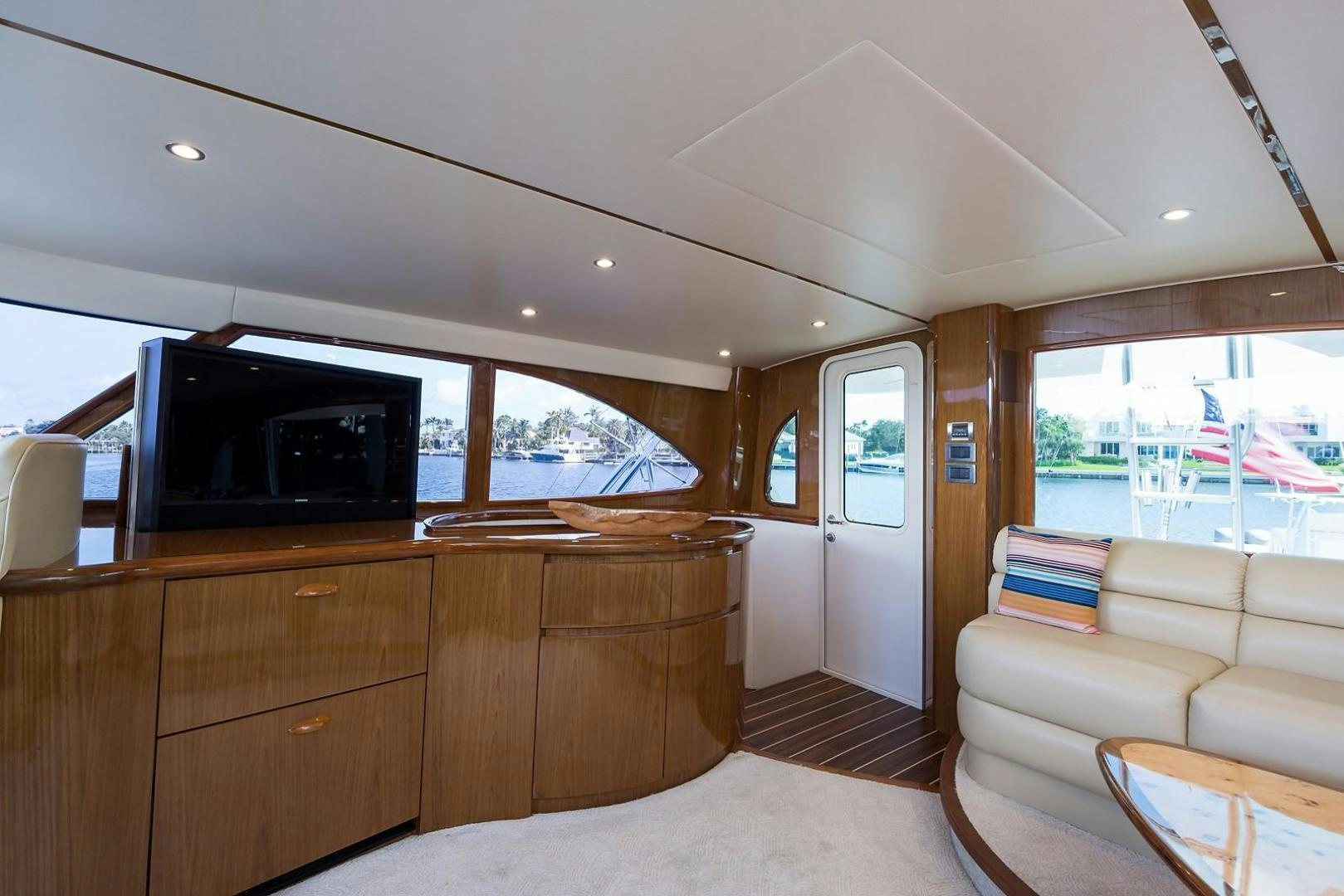 a living room with a couch and a television aboard NO NAME 82 Yacht for Sale
