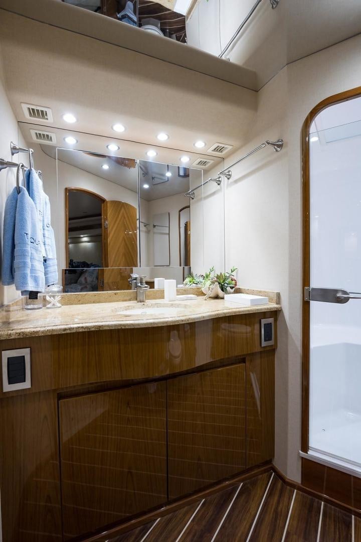 a bathroom with a large mirror aboard NO NAME 82 Yacht for Sale