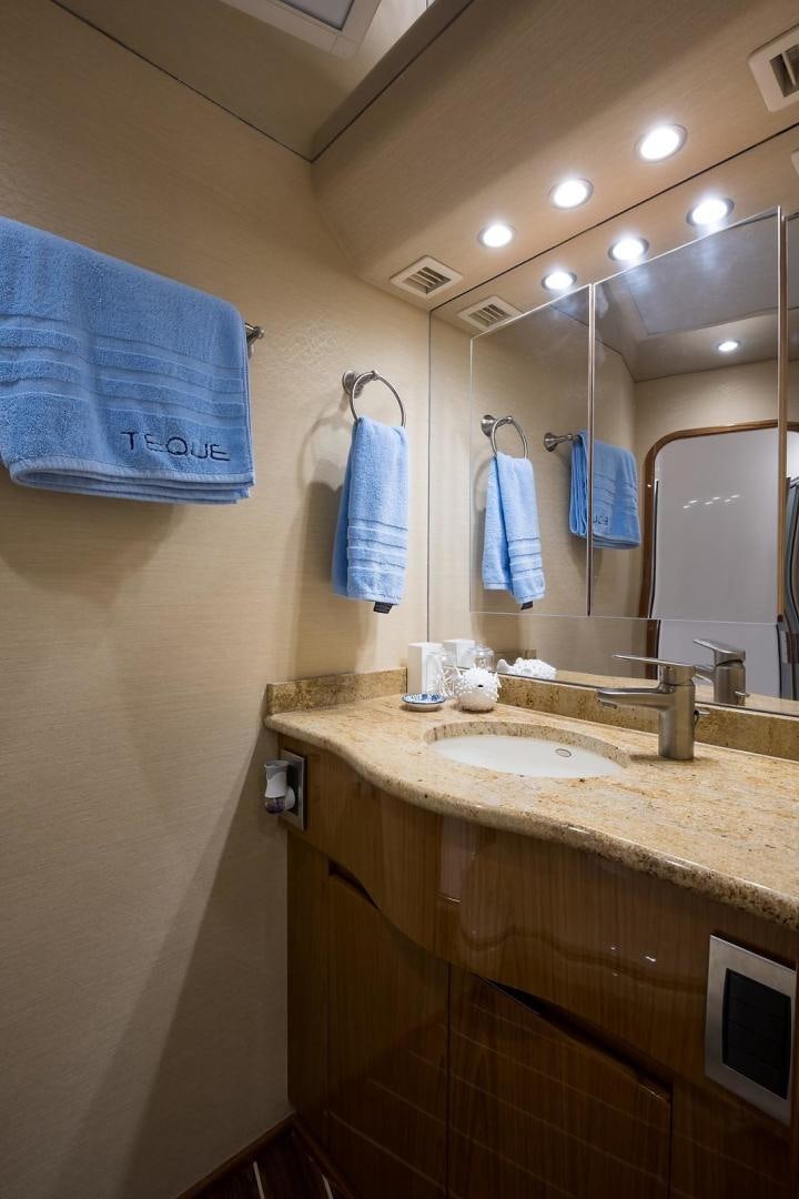 a bathroom with a sink and a mirror aboard NO NAME 82 Yacht for Sale