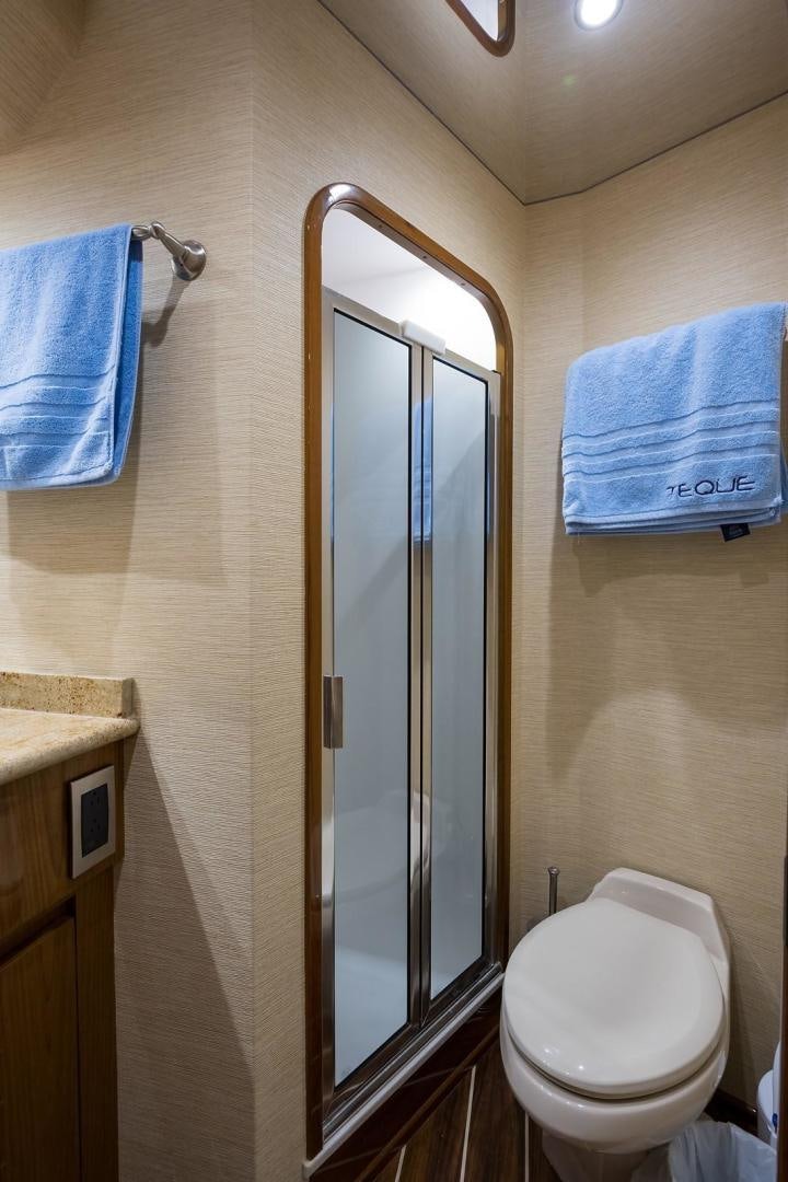 a bathroom with a glass shower door aboard NO NAME 82 Yacht for Sale