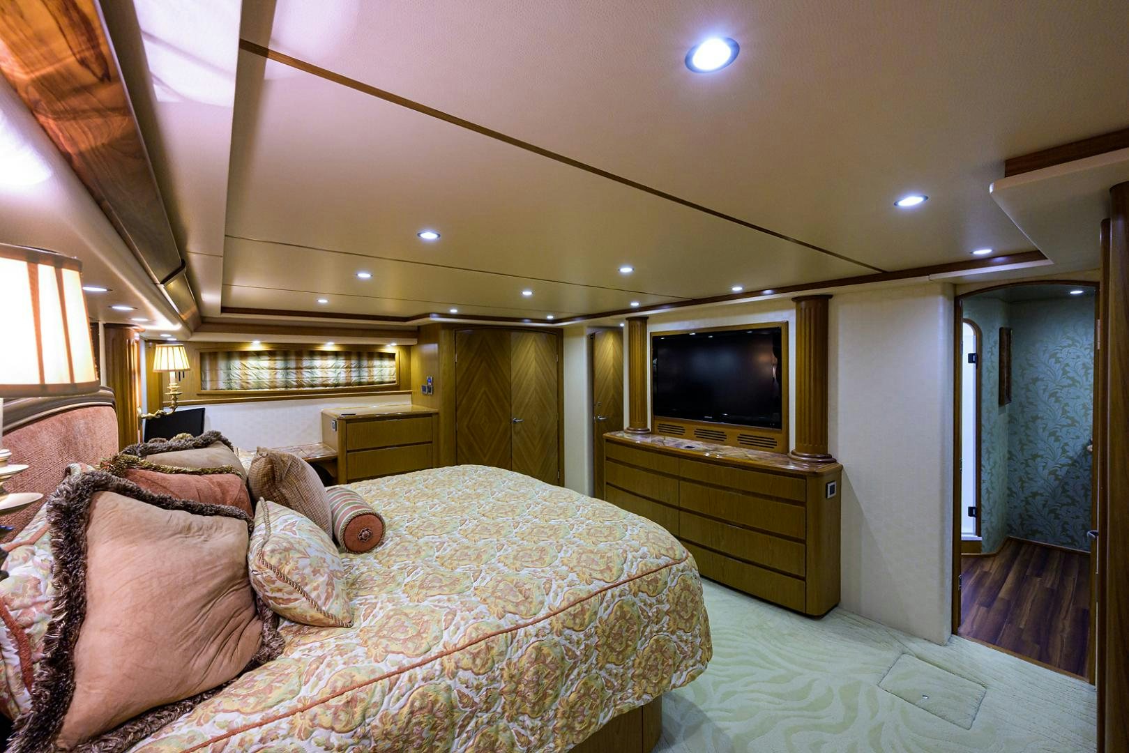a bedroom with a bed and a television aboard RITE ANGLER Yacht for Sale