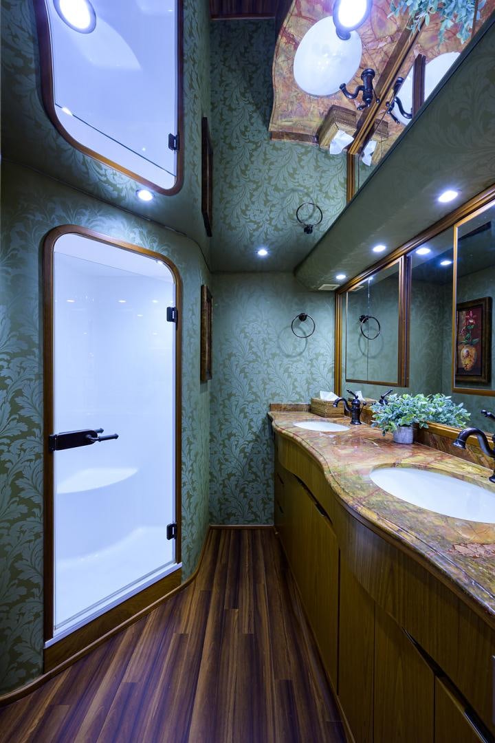 a bathroom with a large mirror aboard RITE ANGLER Yacht for Sale