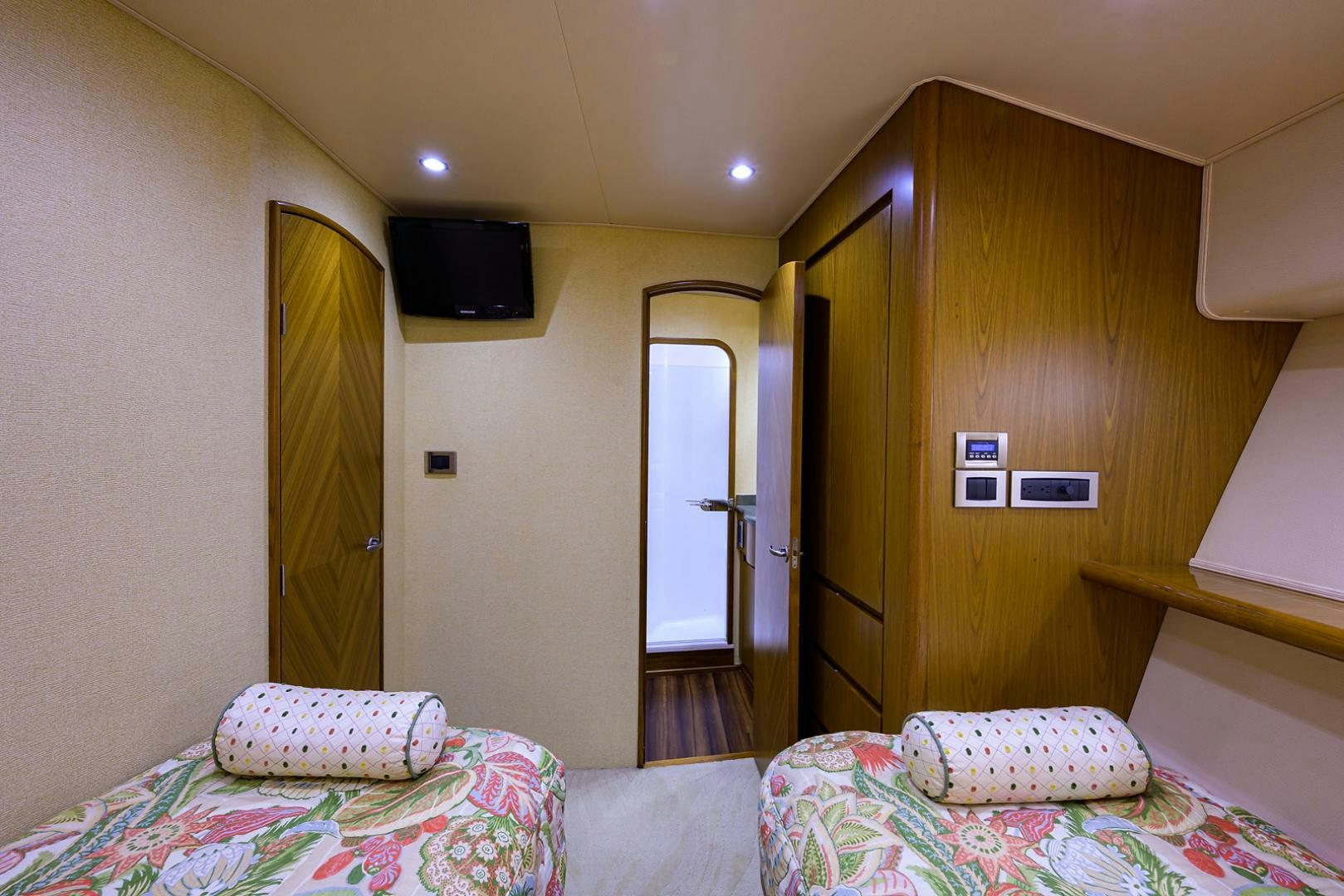 a hotel room with a bed and tv aboard RITE ANGLER Yacht for Sale