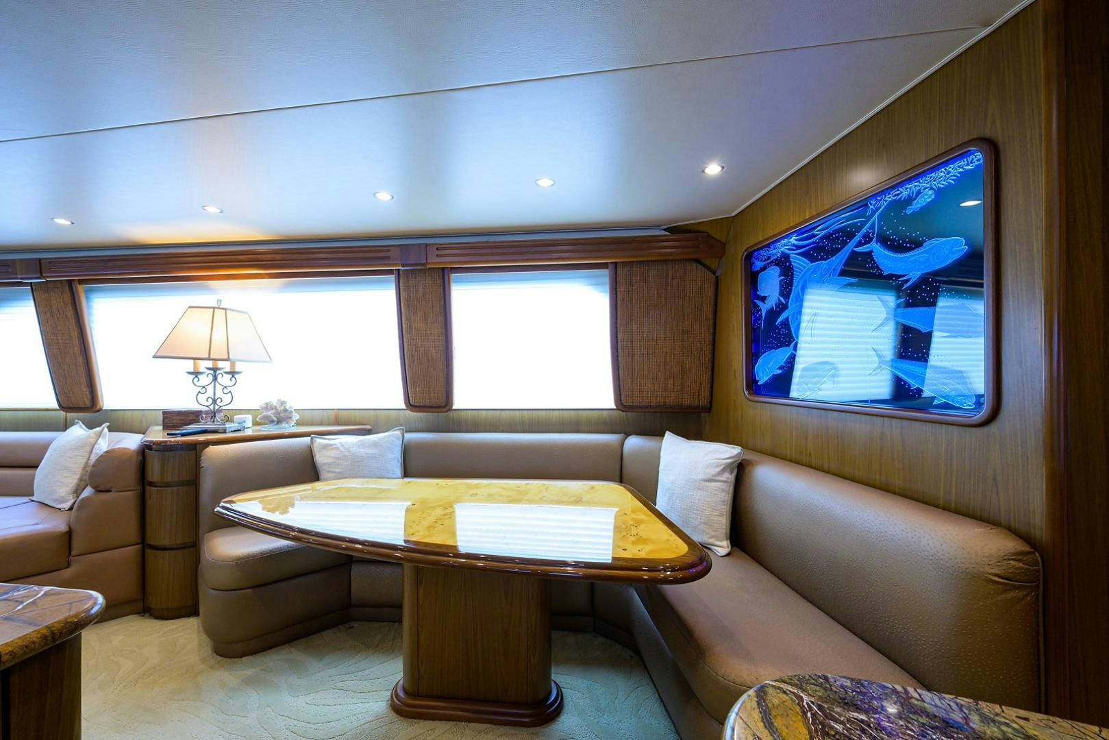 a living room with a couch and a table aboard RITE ANGLER Yacht for Sale