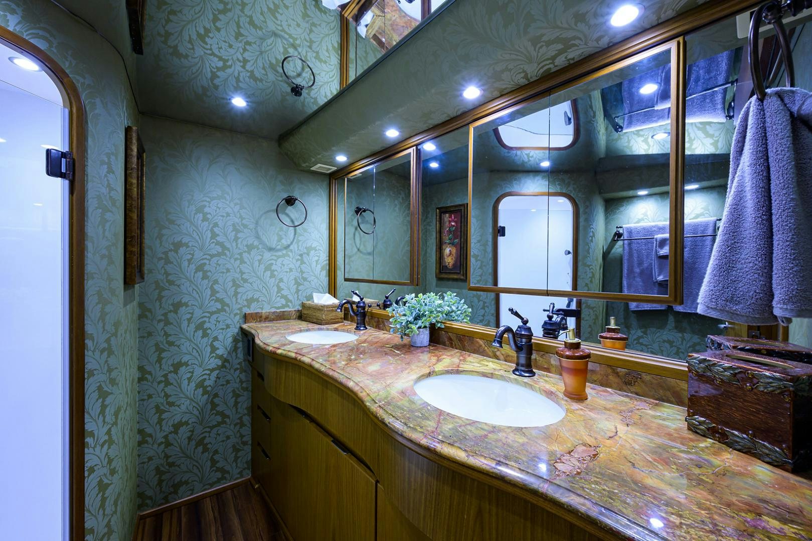 a bathroom with a large mirror aboard RITE ANGLER Yacht for Sale