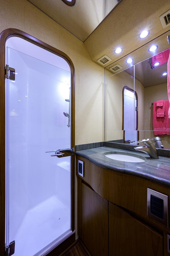 a bathroom with a sink and a mirror aboard RITE ANGLER Yacht for Sale