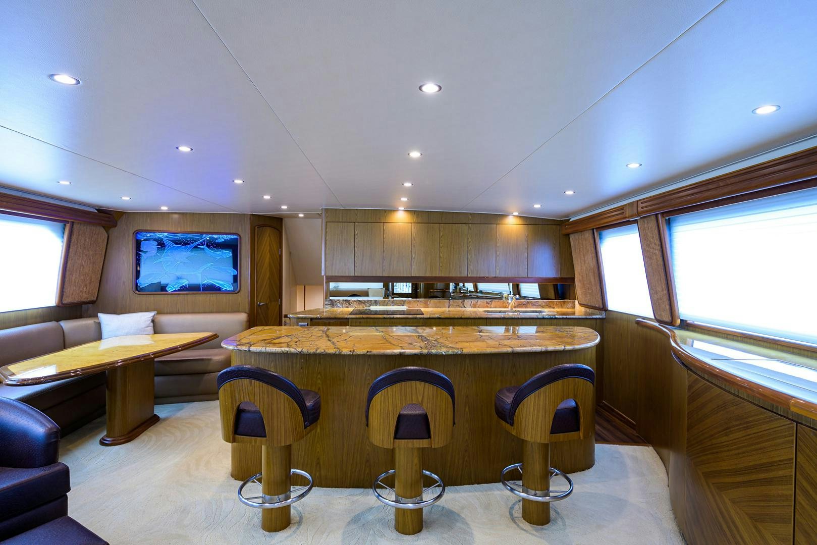 a large kitchen with a bar and bar aboard RITE ANGLER Yacht for Sale