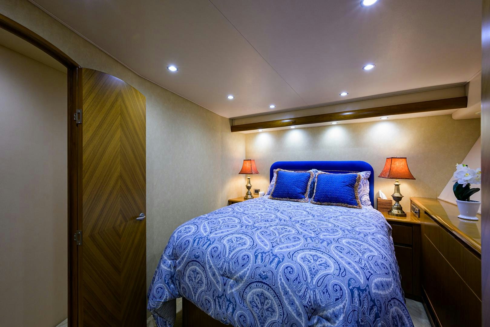 a bed with blue sheets aboard RITE ANGLER Yacht for Sale
