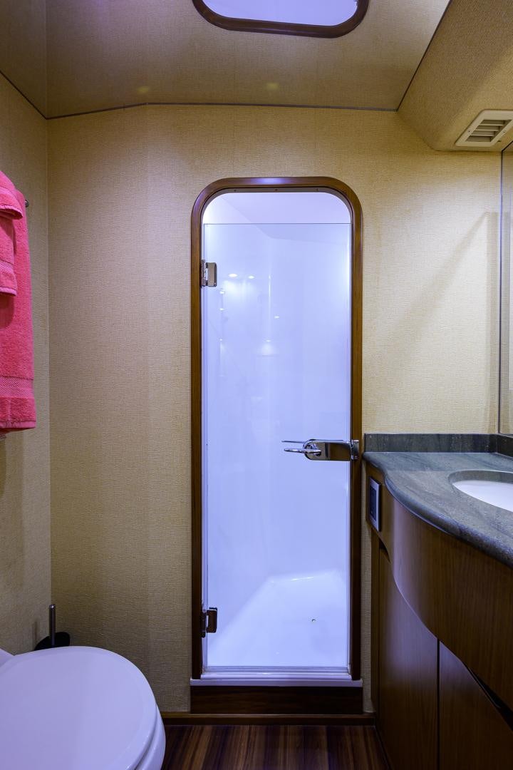a bathroom with a glass door aboard RITE ANGLER Yacht for Sale