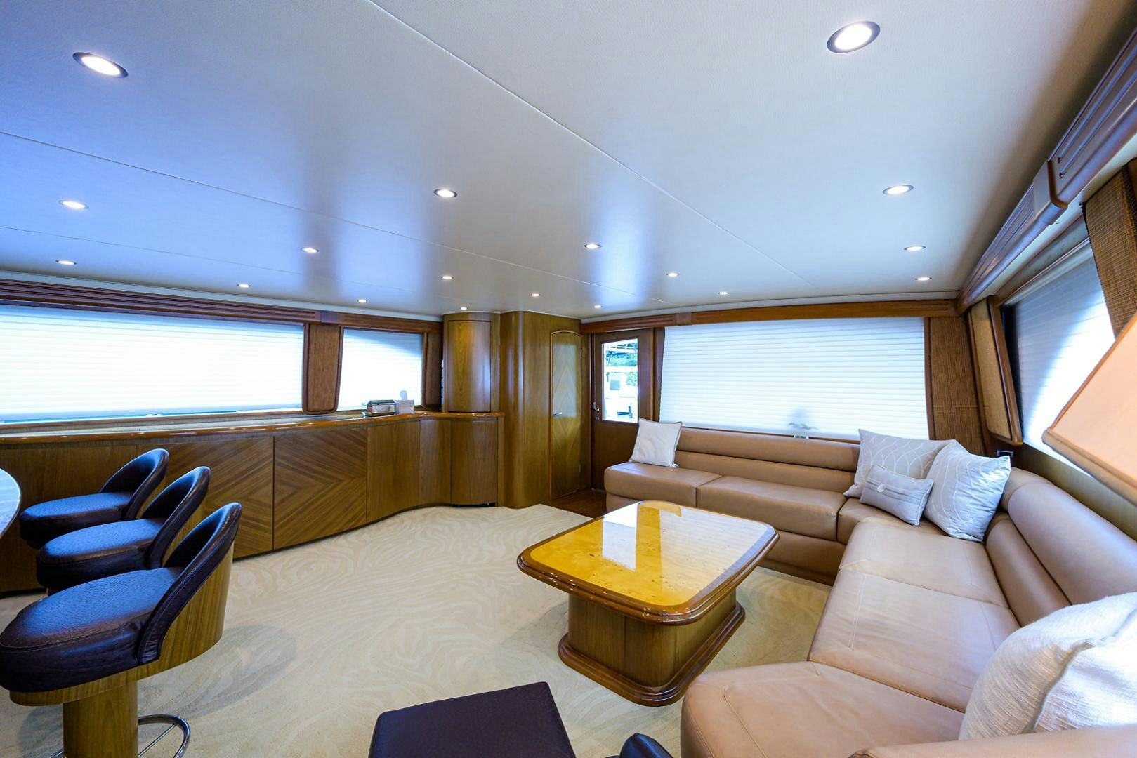 a living room with a couch and a table aboard RITE ANGLER Yacht for Sale