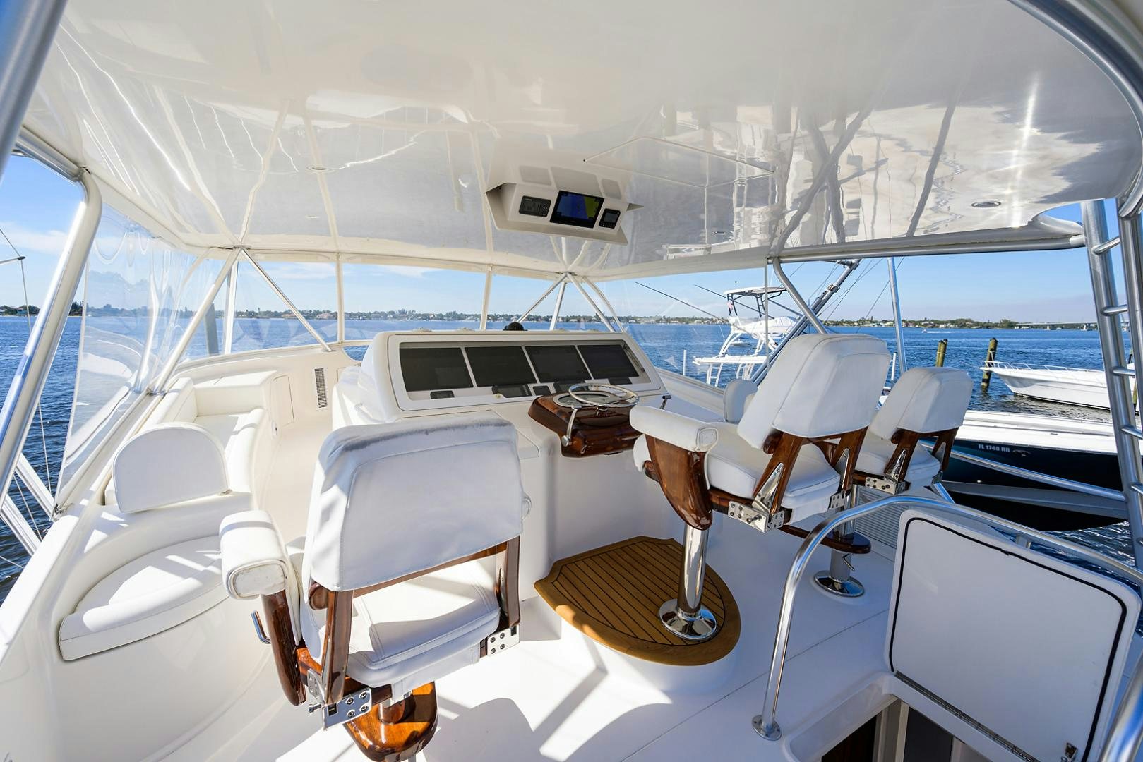 a boat with a seat and a table on it aboard RITE ANGLER Yacht for Sale