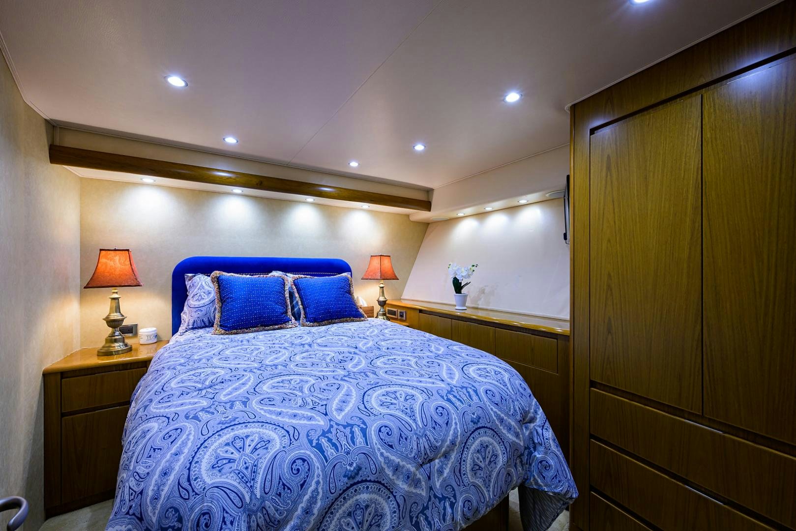 a bed with blue sheets aboard RITE ANGLER Yacht for Sale