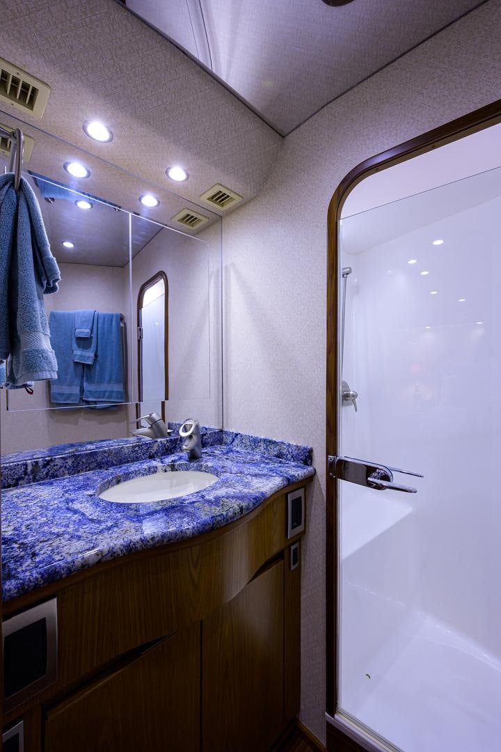a bathroom with a sink and a mirror aboard RITE ANGLER Yacht for Sale