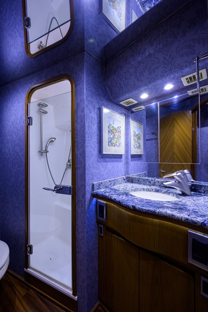 a bathroom with a sink and a mirror aboard RITE ANGLER Yacht for Sale