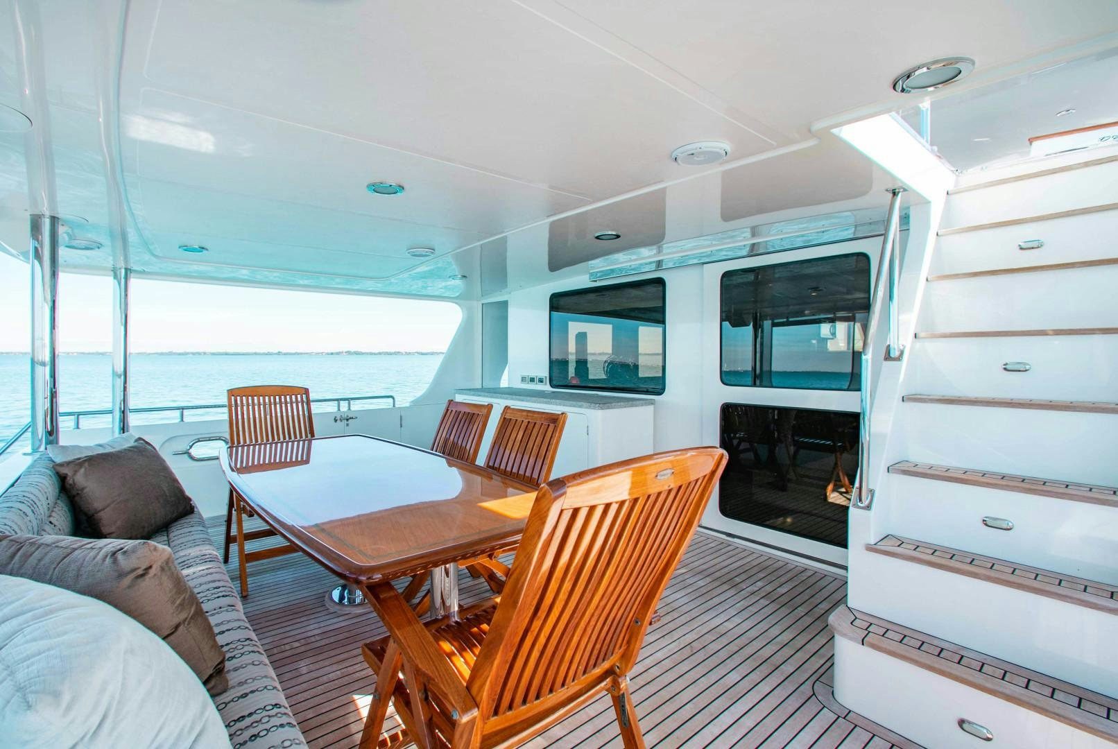 a room with a table and chairs aboard BARBARA SUE II Yacht for Sale