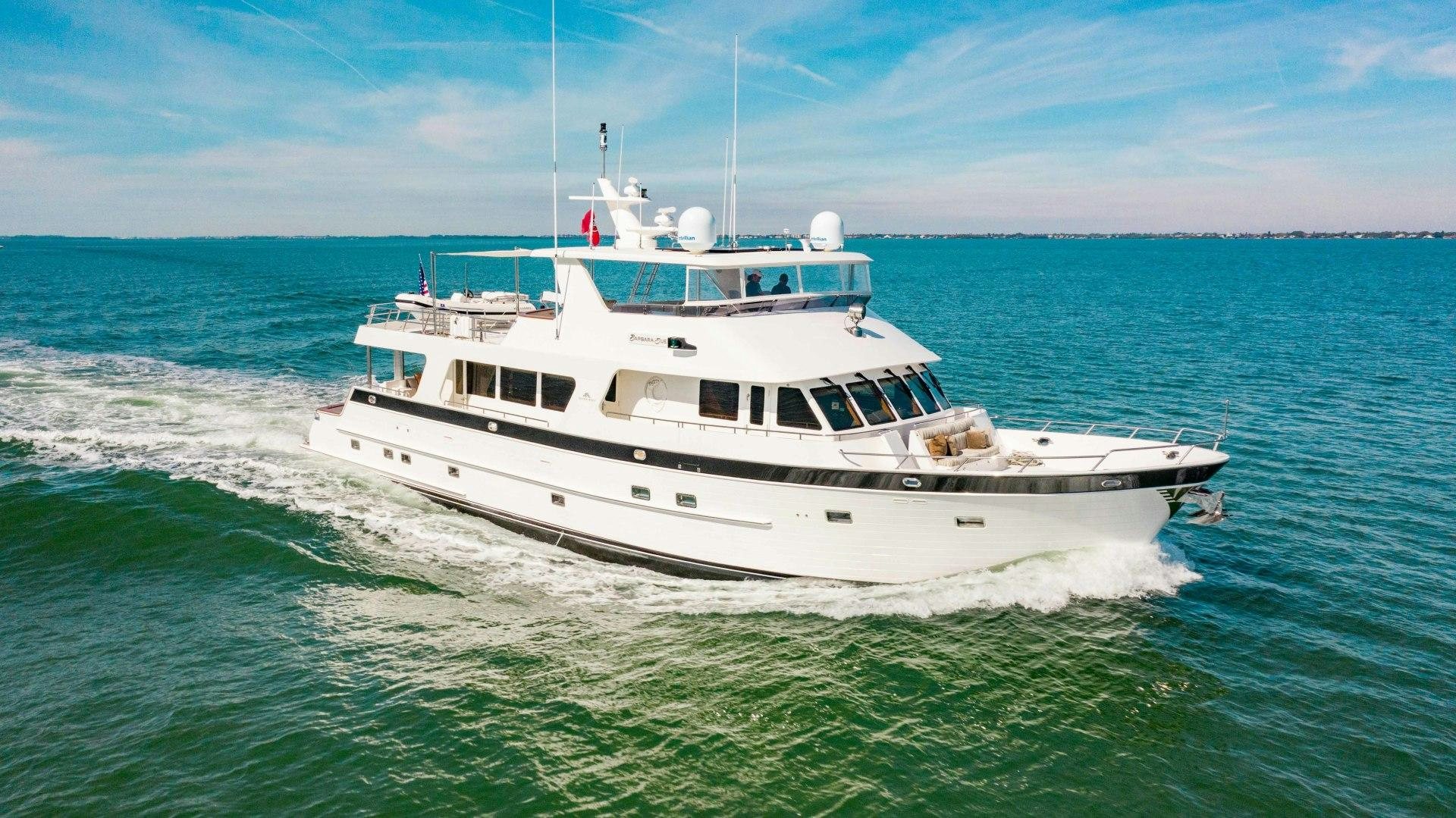 a white boat on the water aboard BARBARA SUE II Yacht for Sale