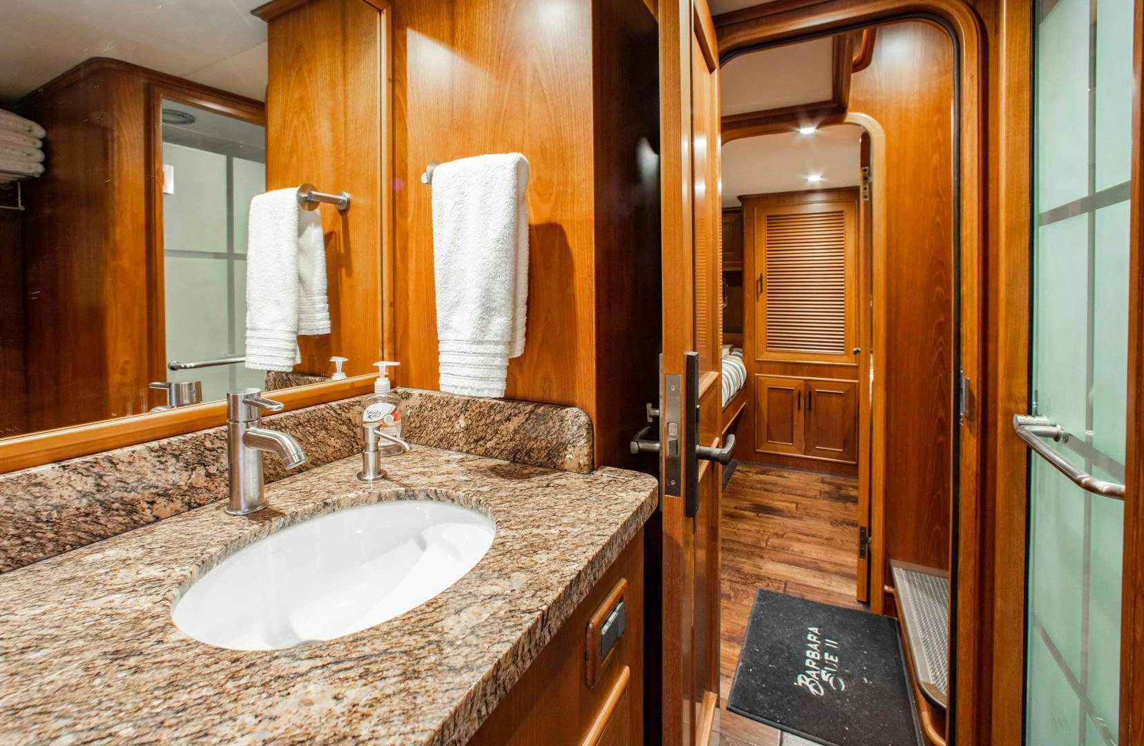 a bathroom with a marble counter top aboard BARBARA SUE II Yacht for Sale