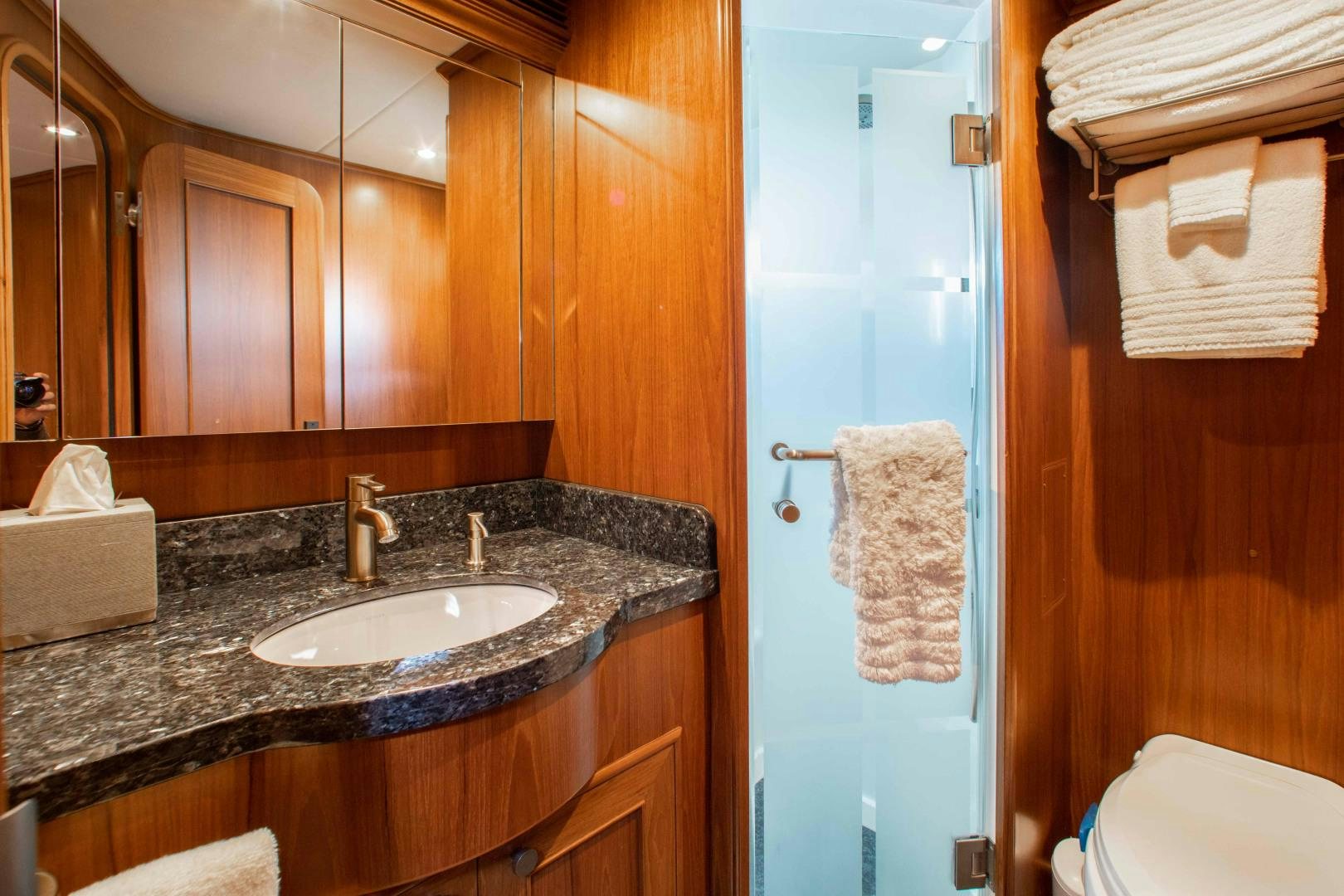 a bathroom with a sink and a mirror aboard BARBARA SUE II Yacht for Sale