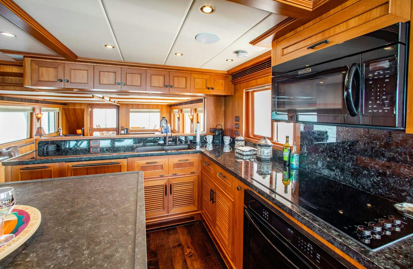a kitchen with a large island aboard BARBARA SUE II Yacht for Sale
