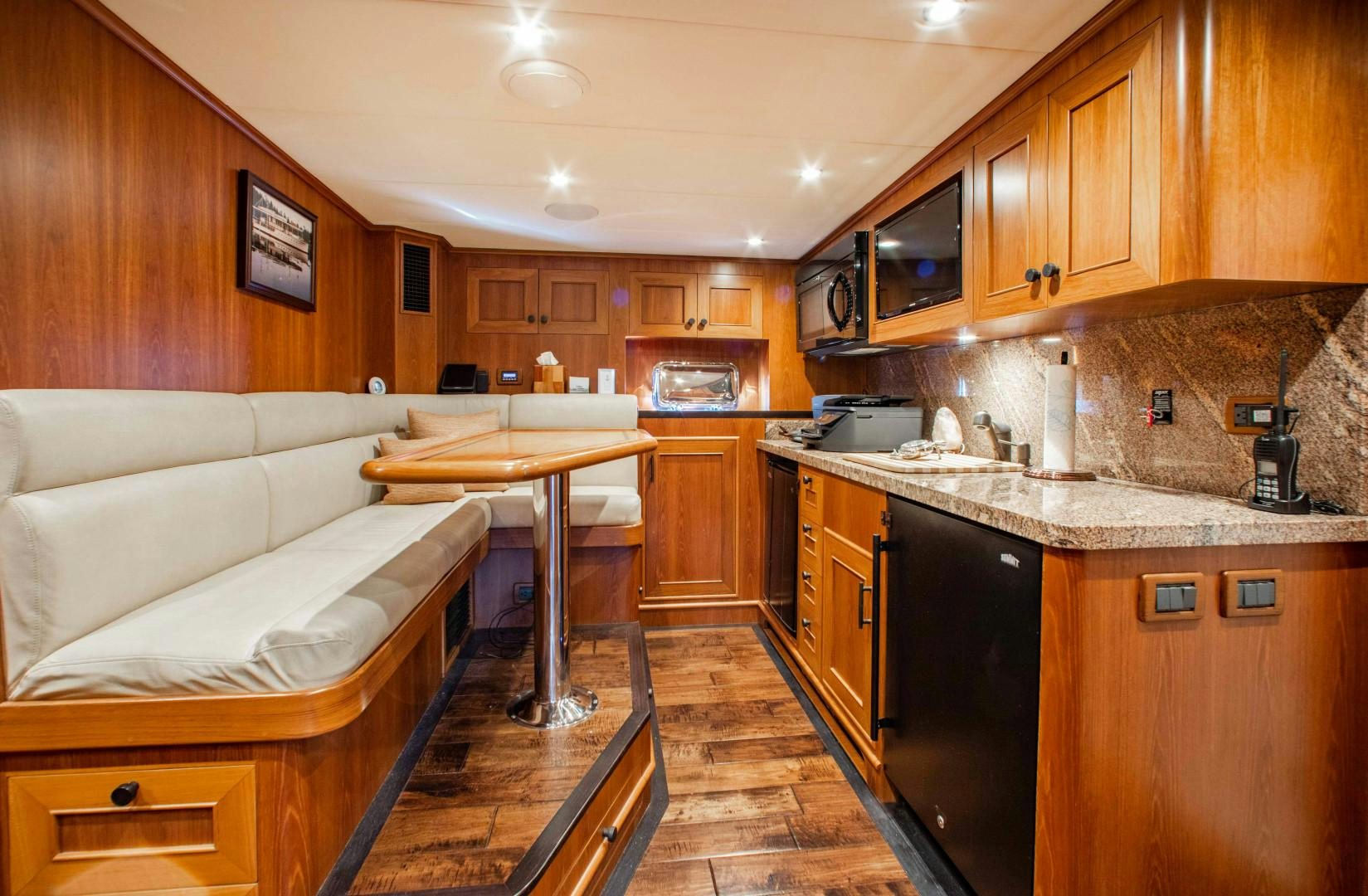 a kitchen with wooden cabinets aboard BARBARA SUE II Yacht for Sale