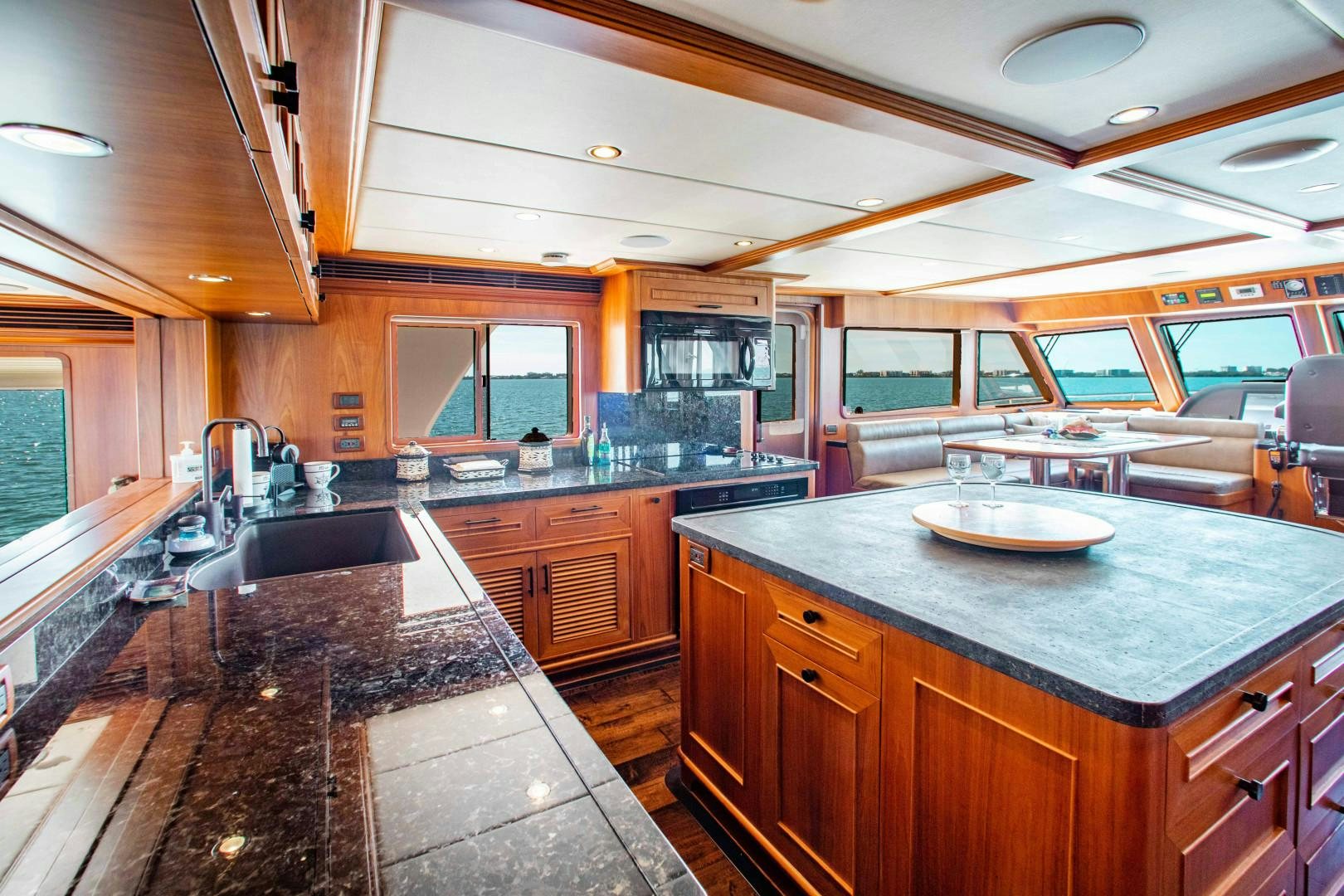a kitchen with a large island aboard BARBARA SUE II Yacht for Sale