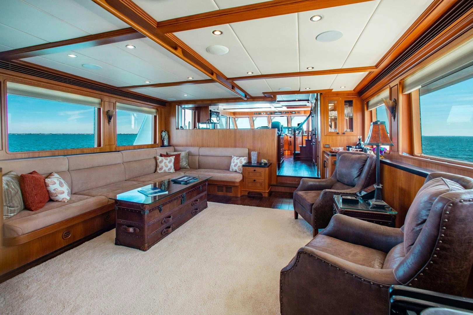 a living room with a couch and a coffee table aboard BARBARA SUE II Yacht for Sale