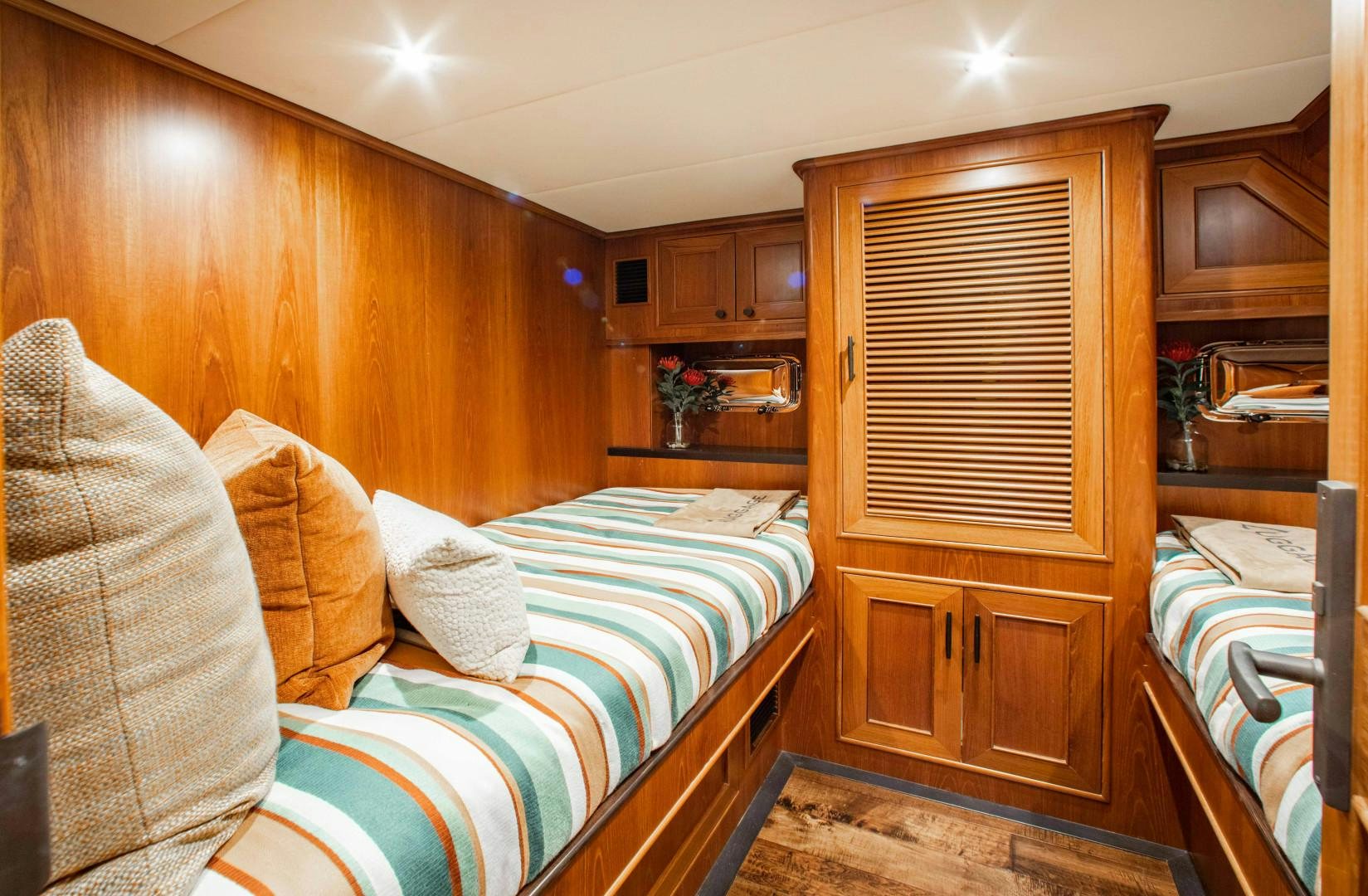 a bedroom with a bed and a couch aboard BARBARA SUE II Yacht for Sale
