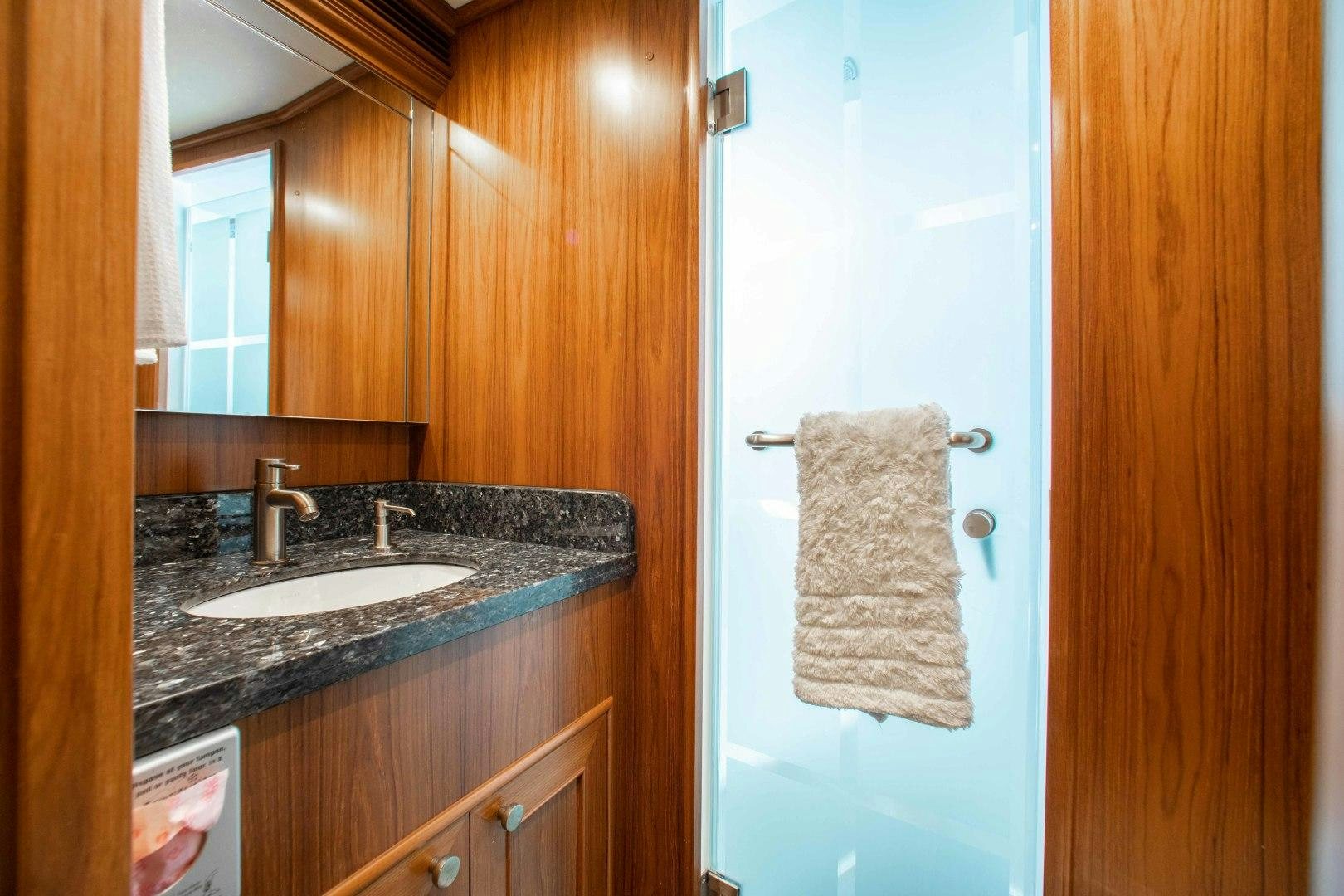 a bathroom with a sink and a mirror aboard BARBARA SUE II Yacht for Sale