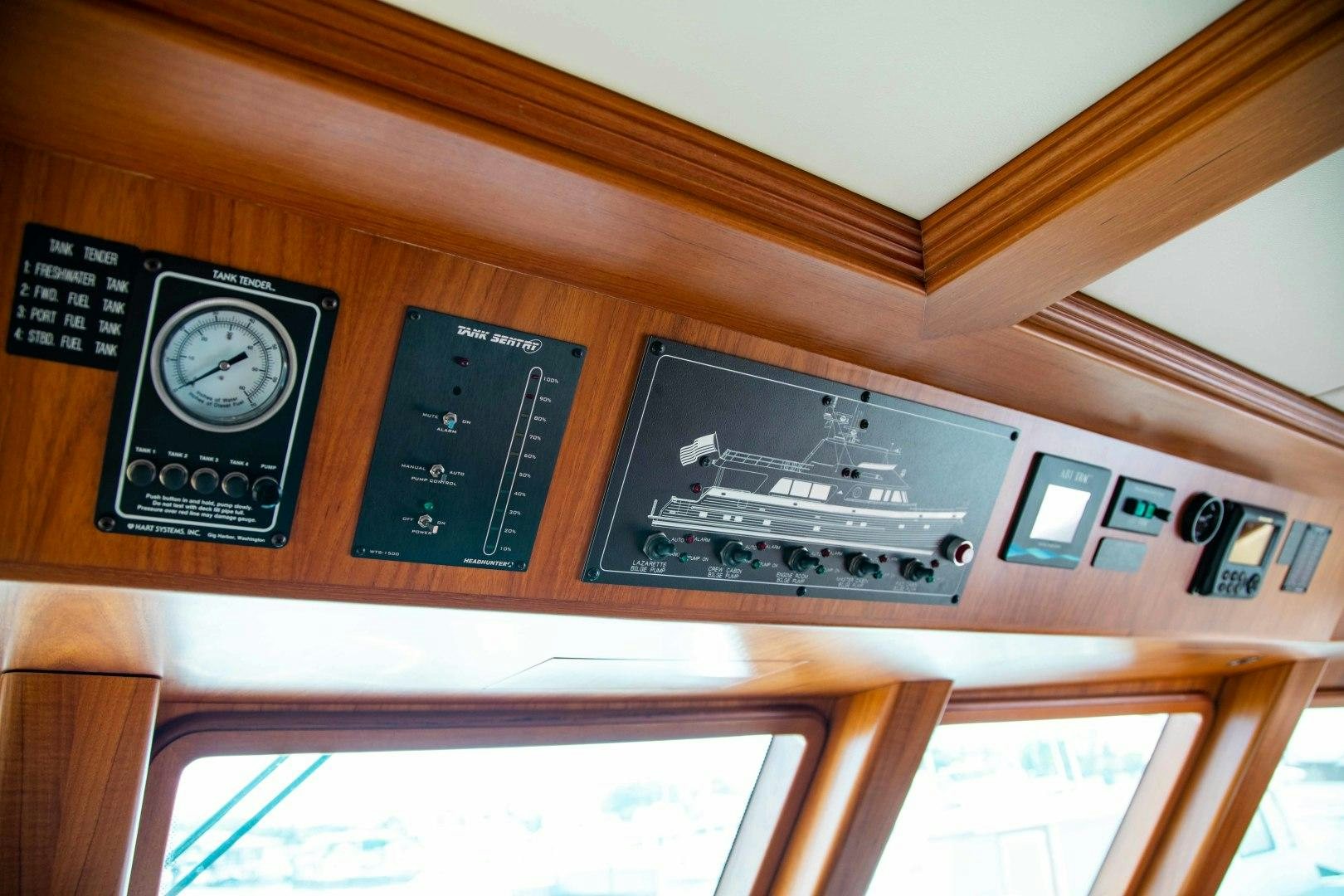 a clock on a wall aboard BARBARA SUE II Yacht for Sale