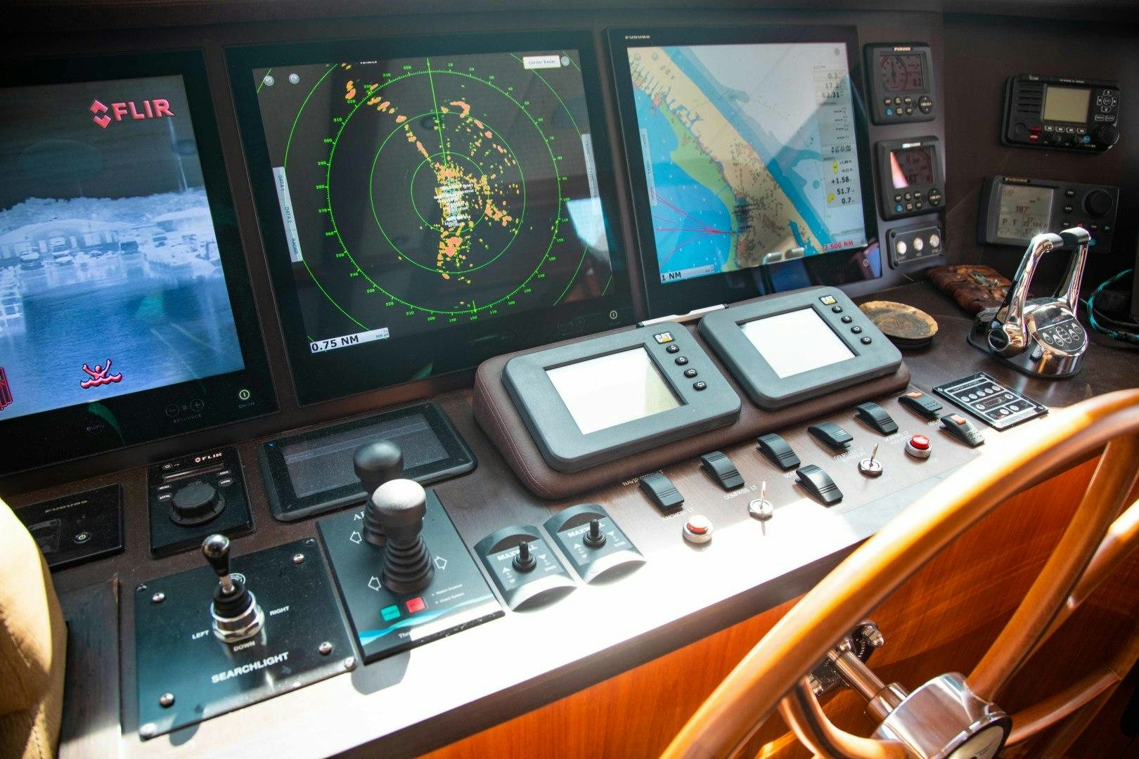 a control panel with a screen and buttons aboard BARBARA SUE II Yacht for Sale