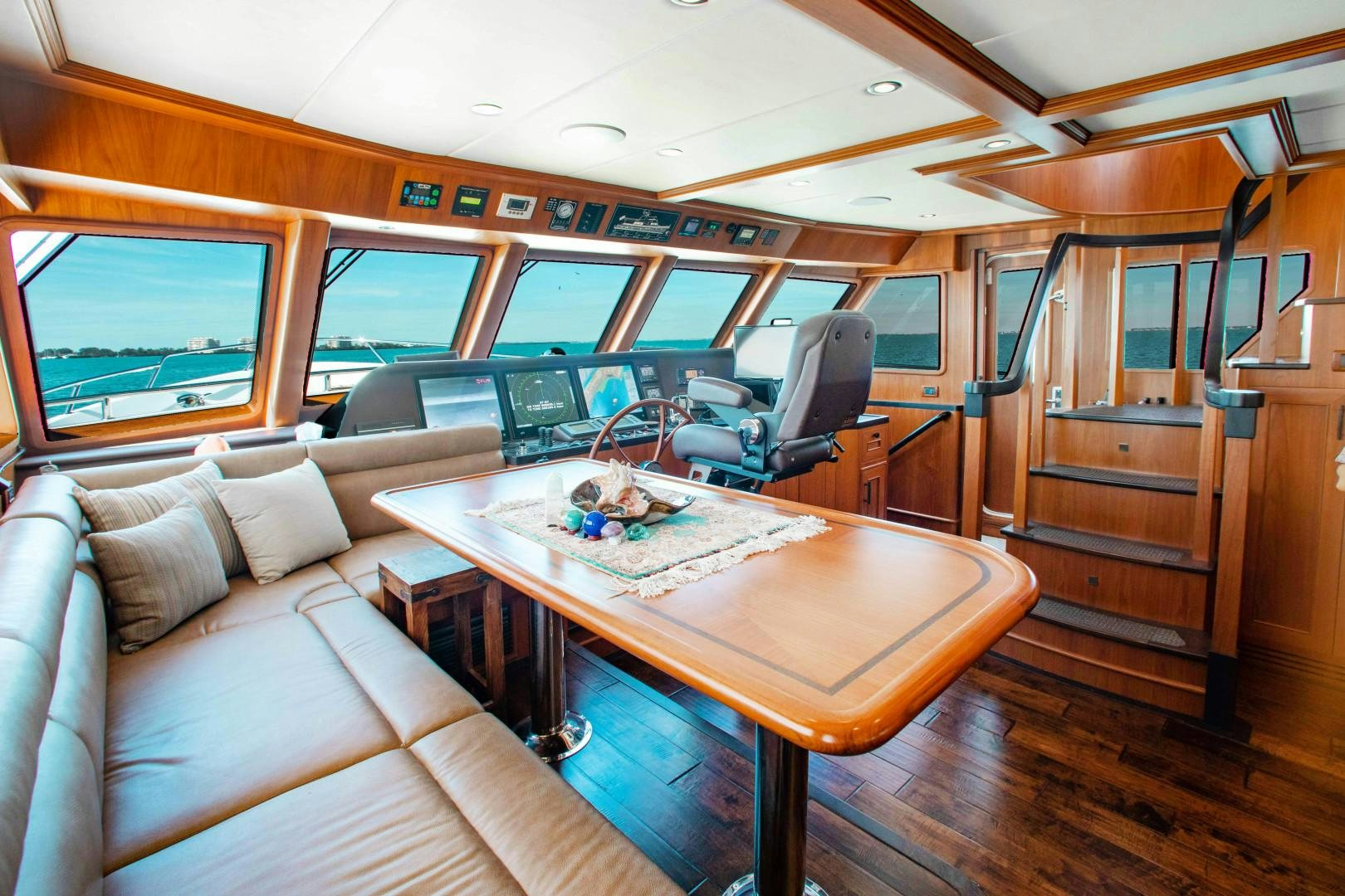 a room with a couch and a table aboard BARBARA SUE II Yacht for Sale
