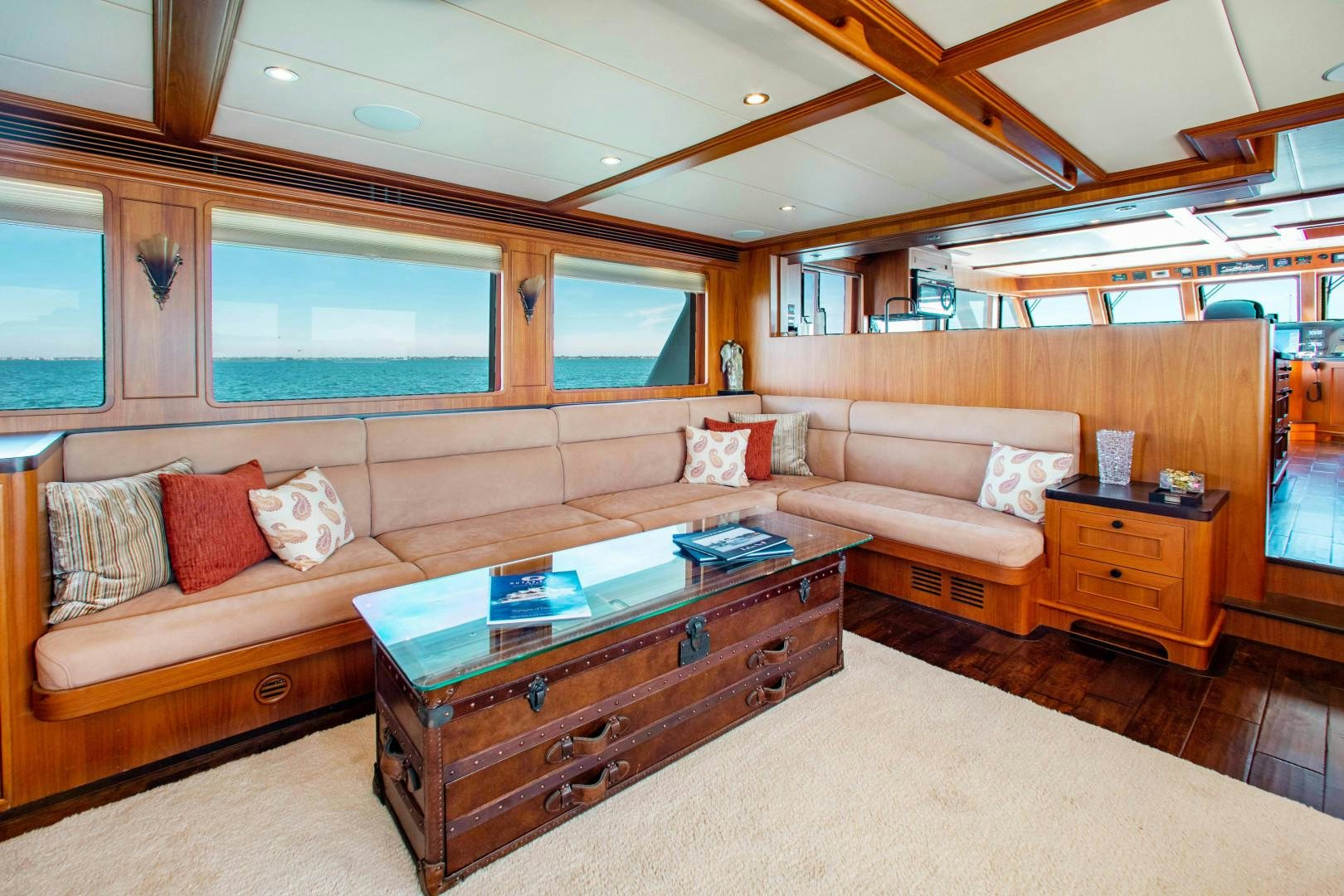 a living room with a couch and a coffee table aboard BARBARA SUE II Yacht for Sale