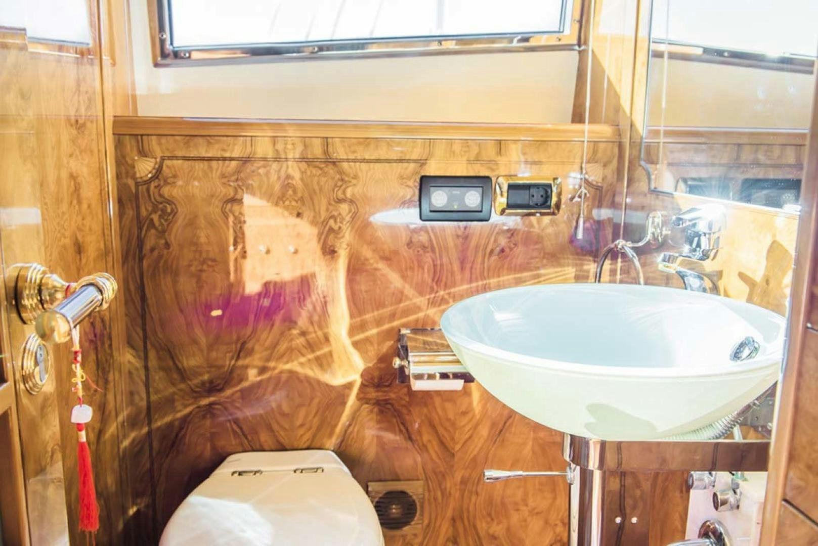 a bathroom with a sink and toilet aboard HEMERA CUARTA Yacht for Sale