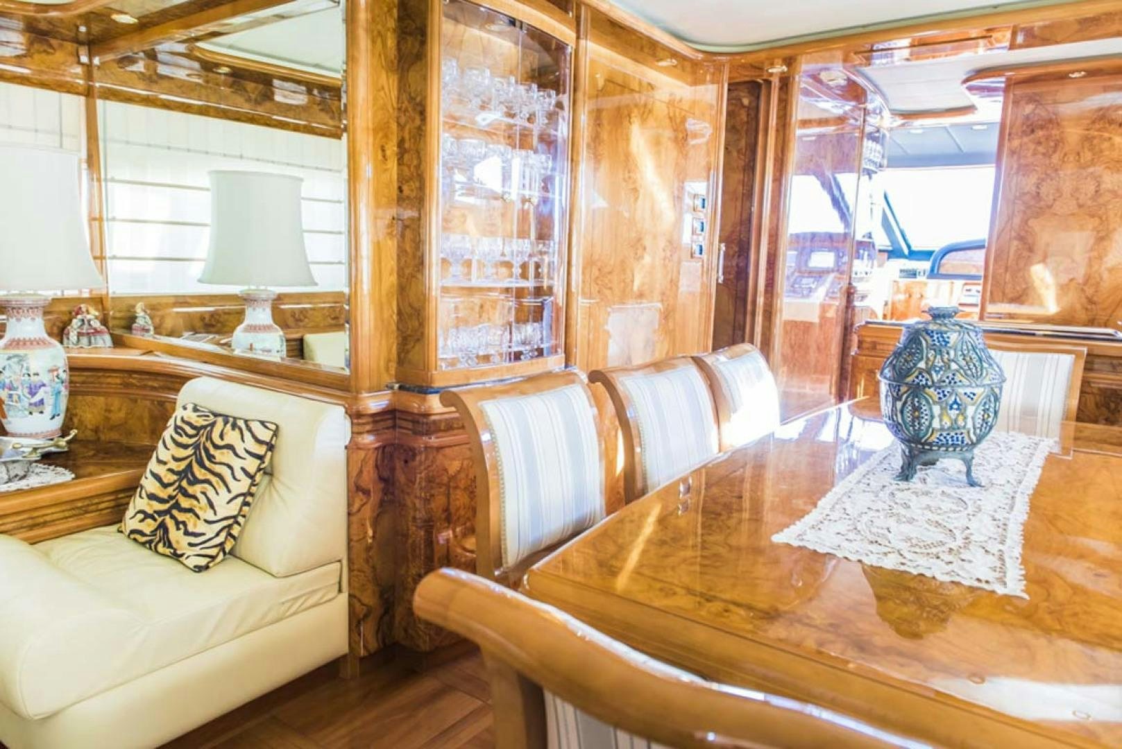 a room with a couch and a table aboard HEMERA CUARTA Yacht for Sale