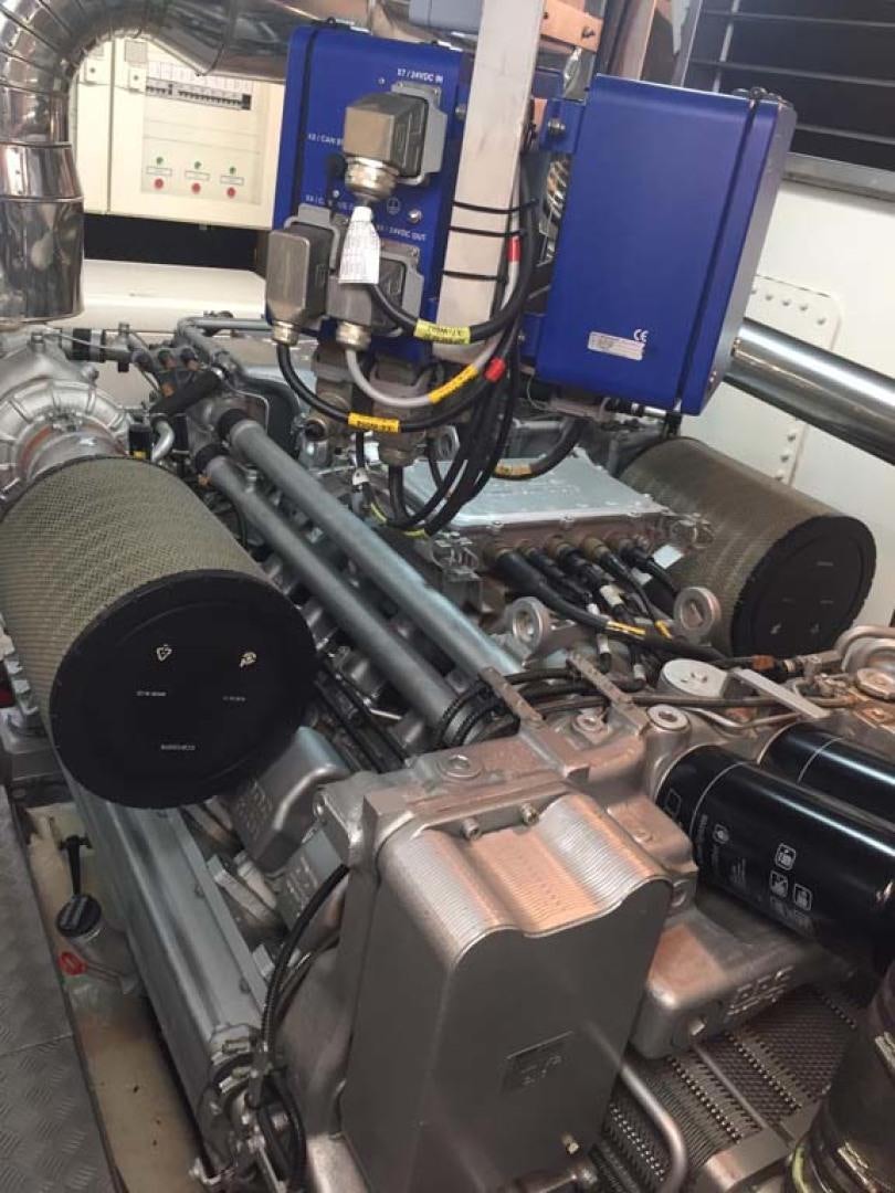a car engine with a blue door aboard HEMERA CUARTA Yacht for Sale