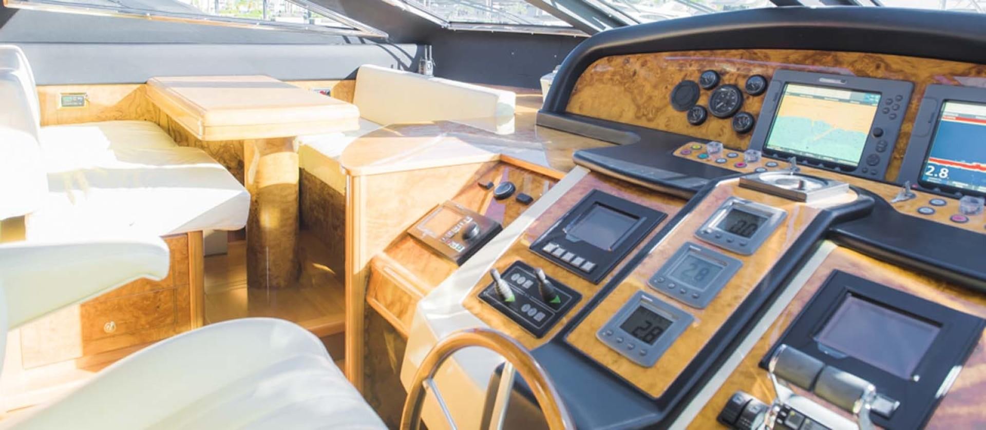 a table with many electronic devices on it aboard HEMERA CUARTA Yacht for Sale