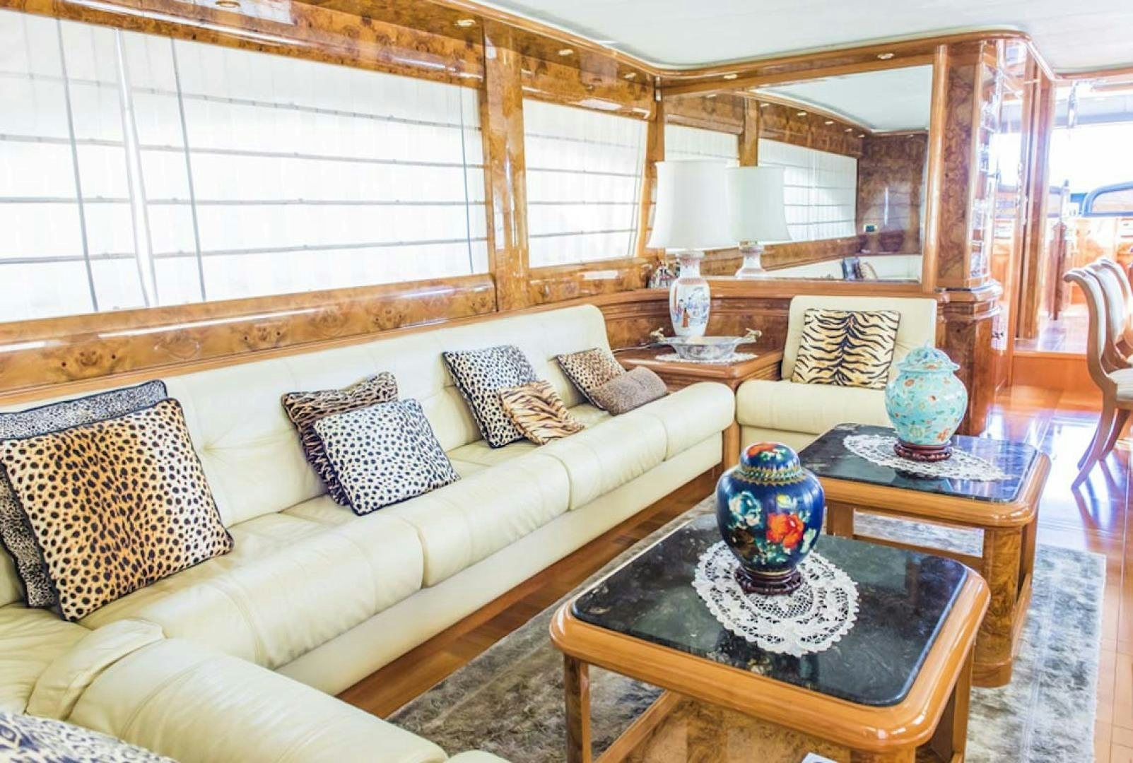 a living room with a large window aboard HEMERA CUARTA Yacht for Sale