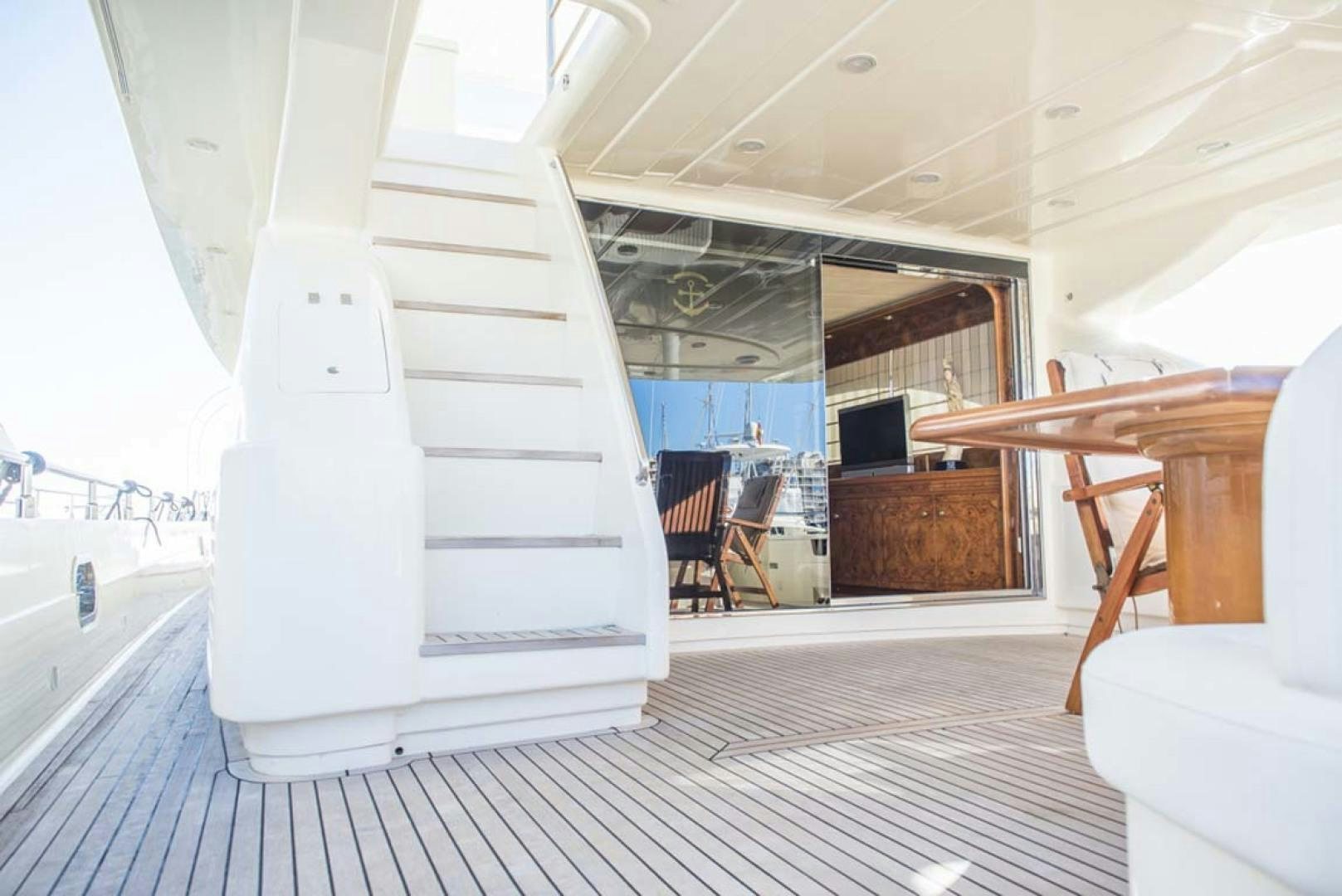 a staircase with a spiral staircase aboard HEMERA CUARTA Yacht for Sale