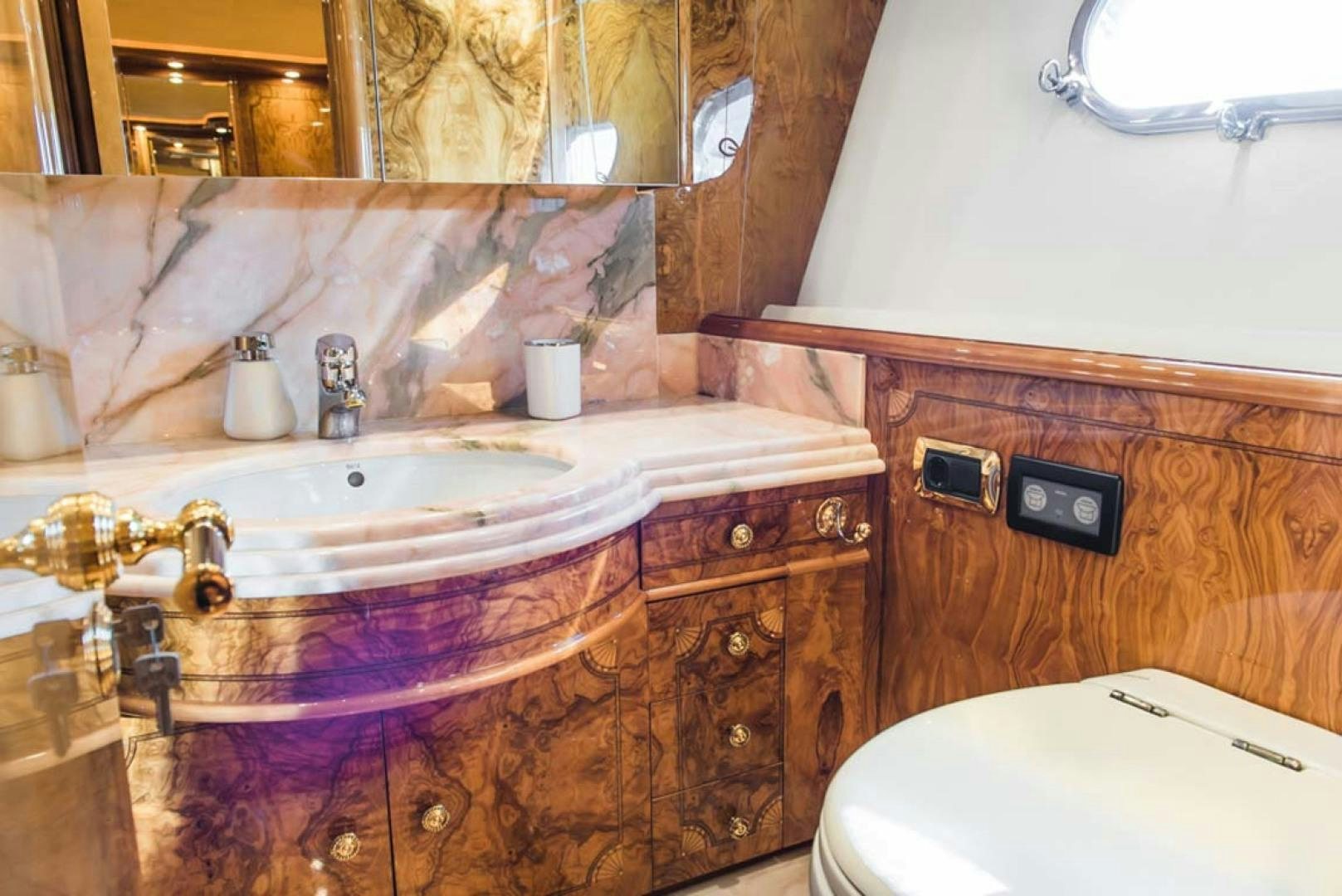 a bathroom with a sink and a toilet aboard HEMERA CUARTA Yacht for Sale