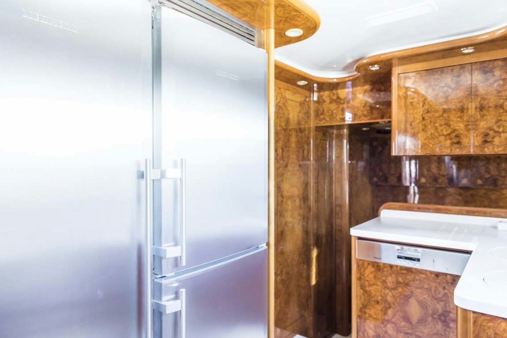a room with a glass door and a white counter and a ceiling fan aboard HEMERA CUARTA Yacht for Sale