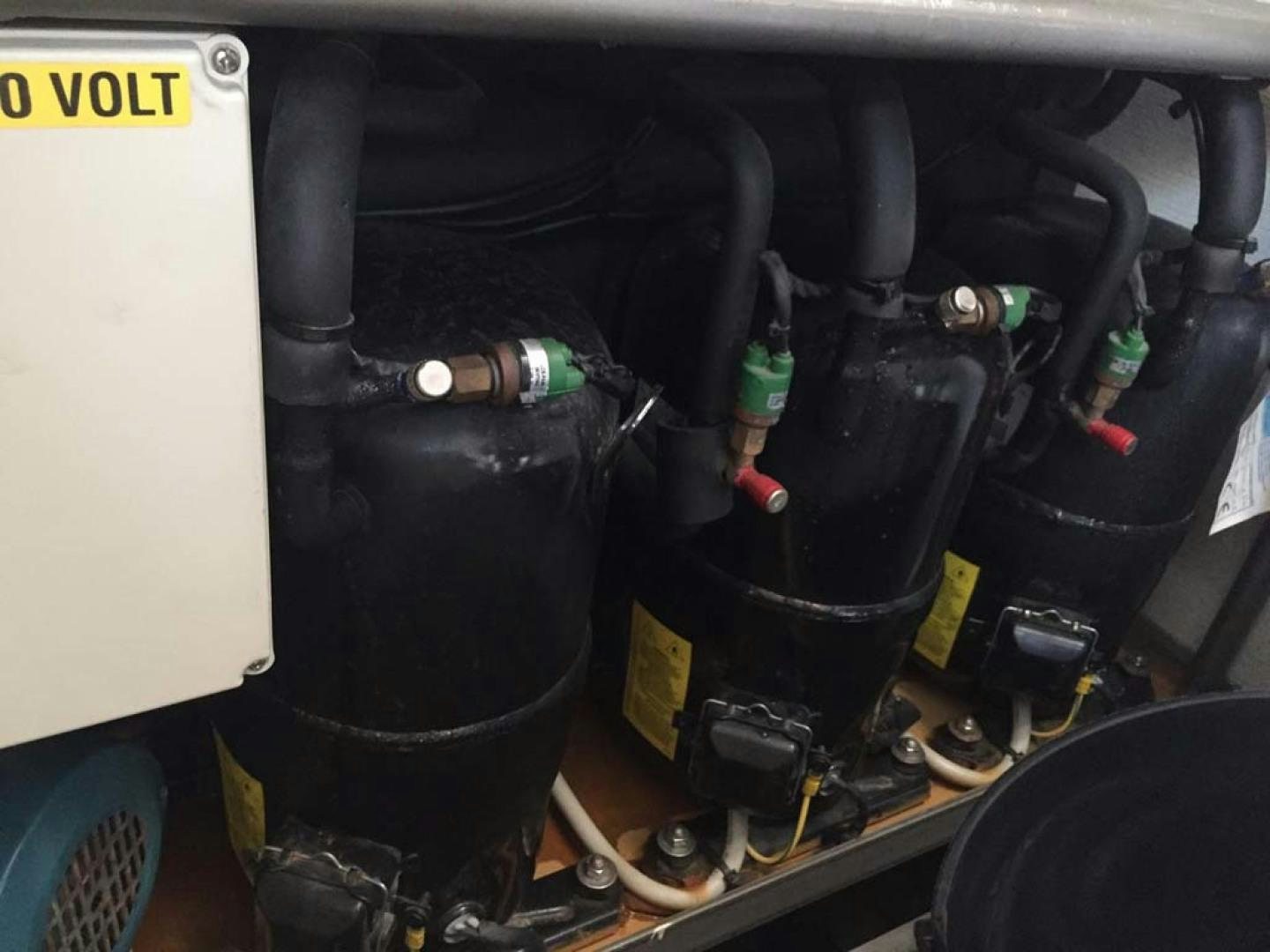 a car engine with a black hood aboard HEMERA CUARTA Yacht for Sale