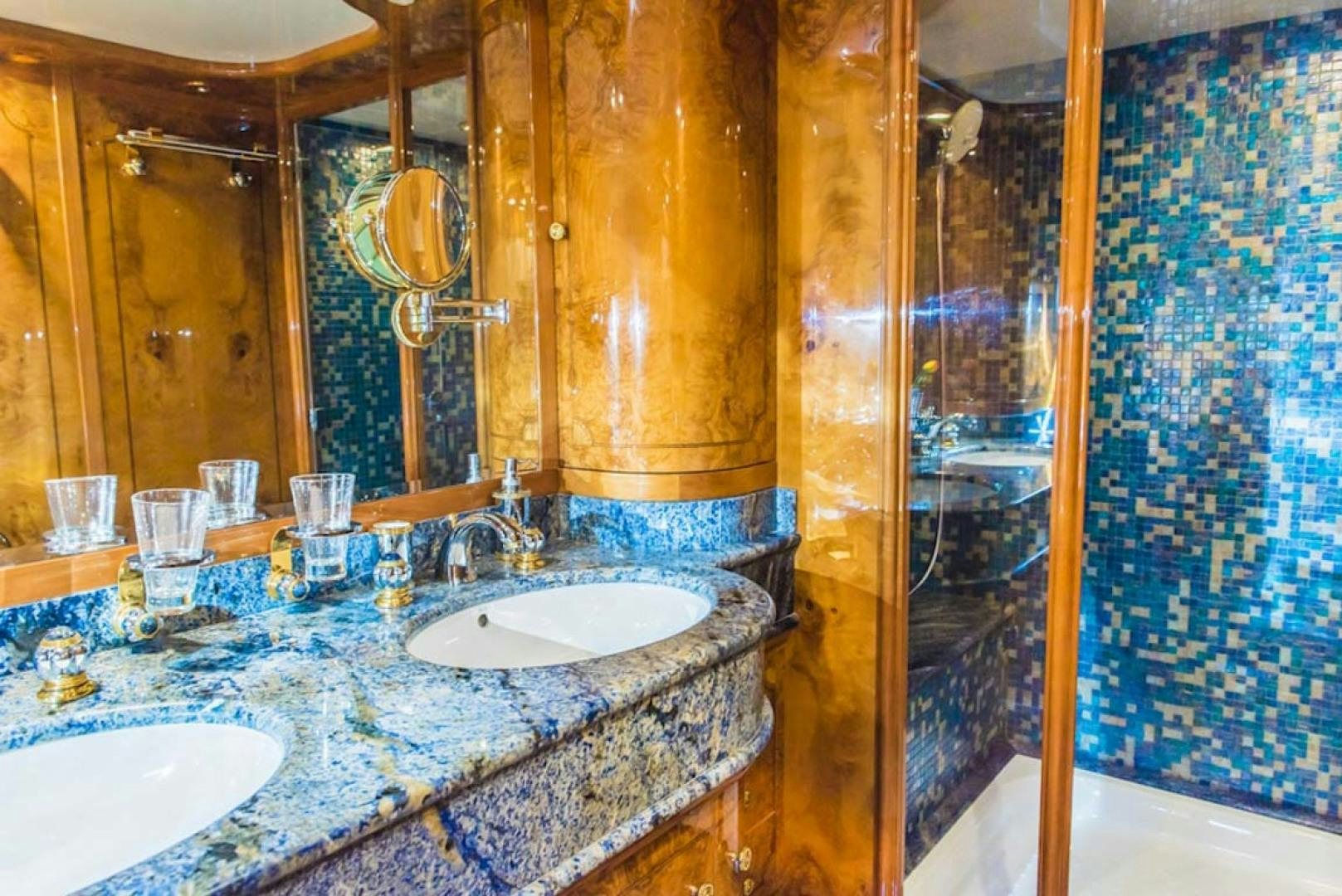 a bathroom with a marble counter top aboard HEMERA CUARTA Yacht for Sale