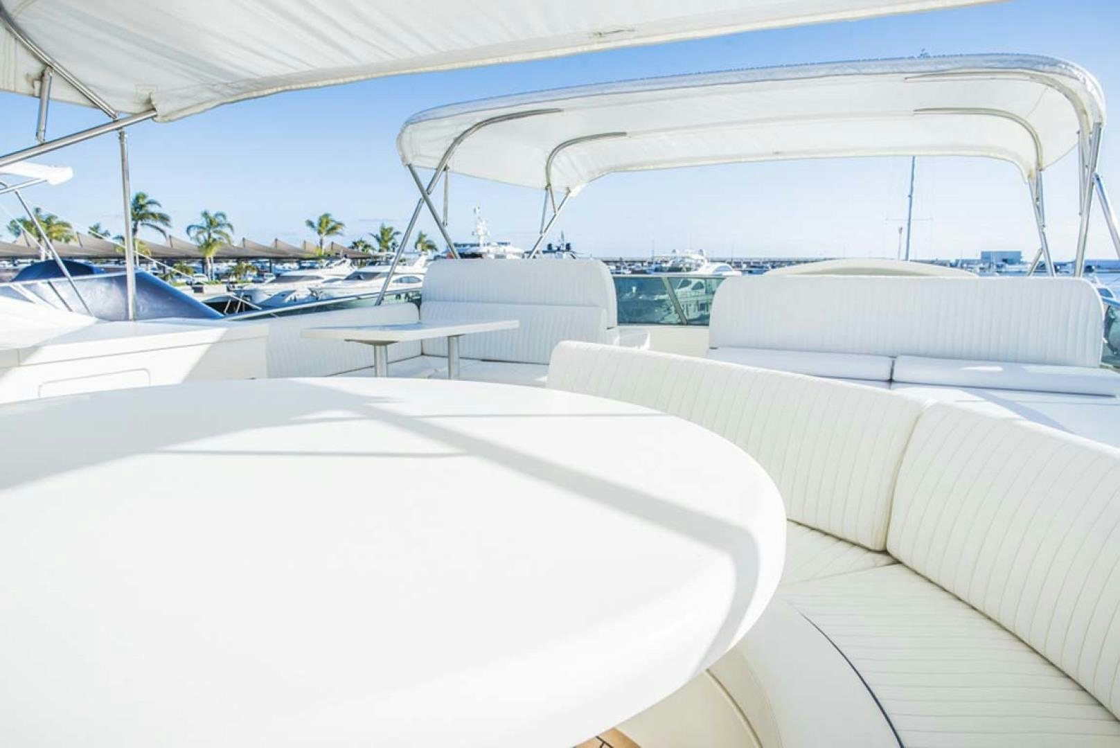 a large white lounge chair next to a pool aboard HEMERA CUARTA Yacht for Sale