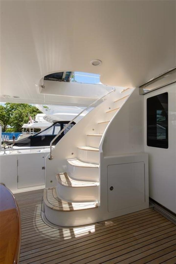 a white staircase in a room aboard OCEANA Yacht for Sale