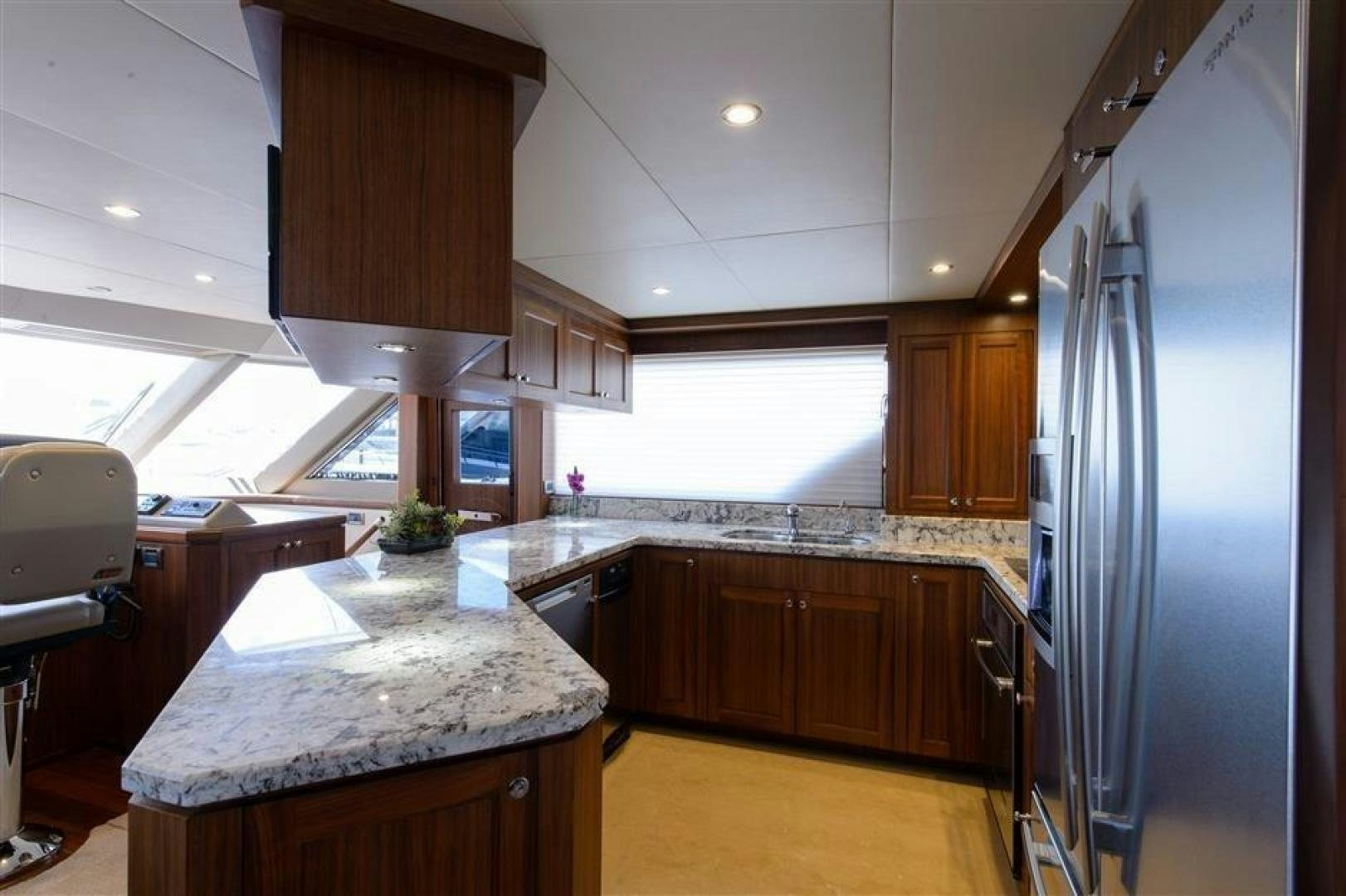 a kitchen with a large island aboard OCEANA Yacht for Sale