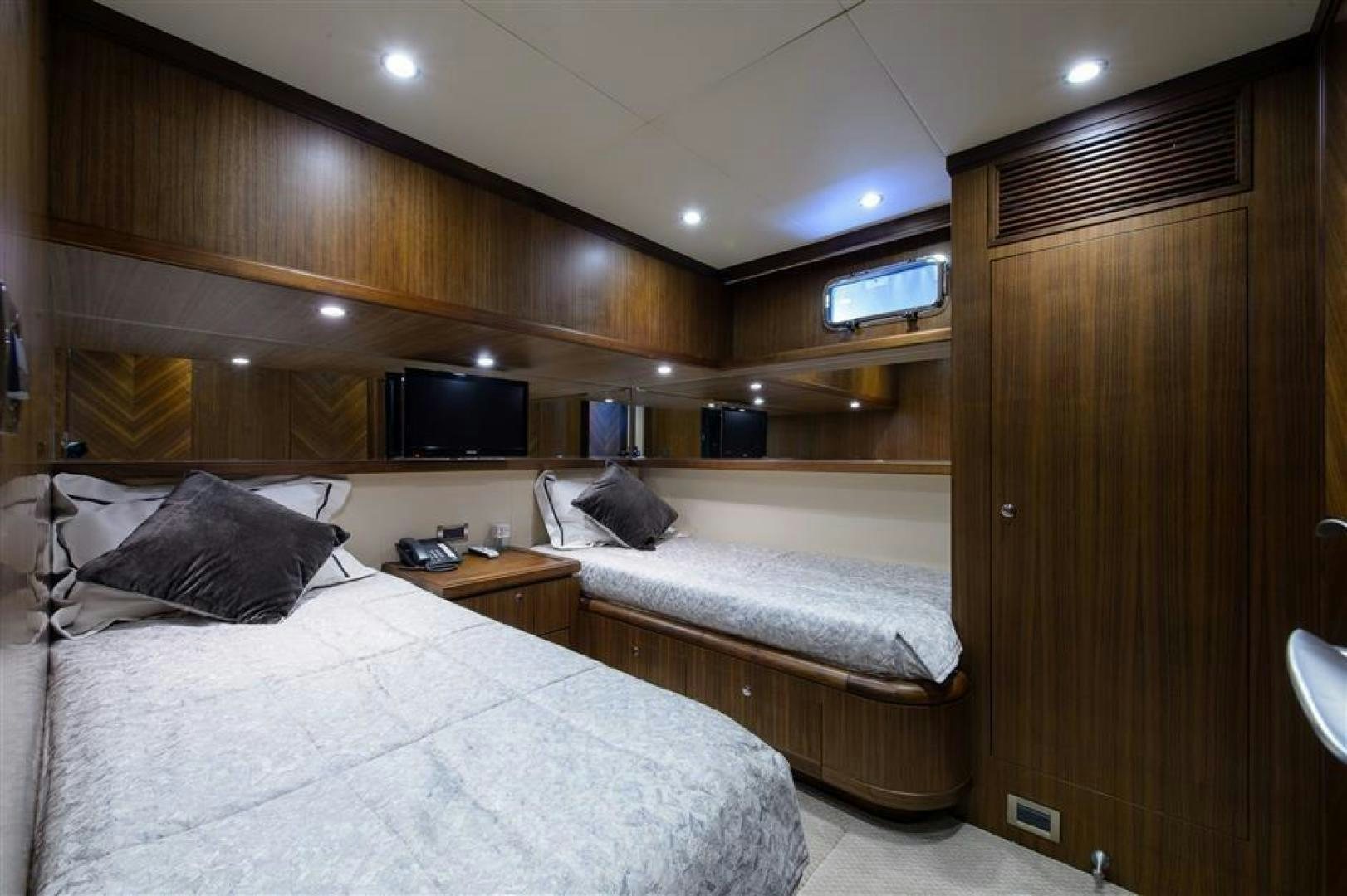 a room with two beds aboard OCEANA Yacht for Sale